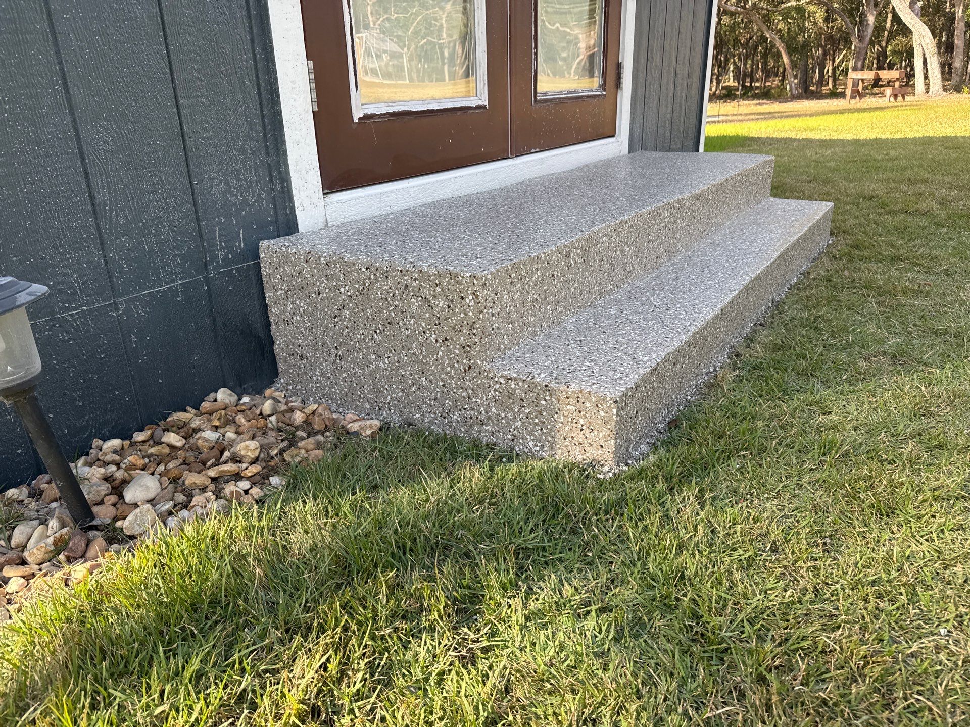 Front and Back Porches in Chiefland, FL in Pebble Beach by Cross Creek Concrete Coatings