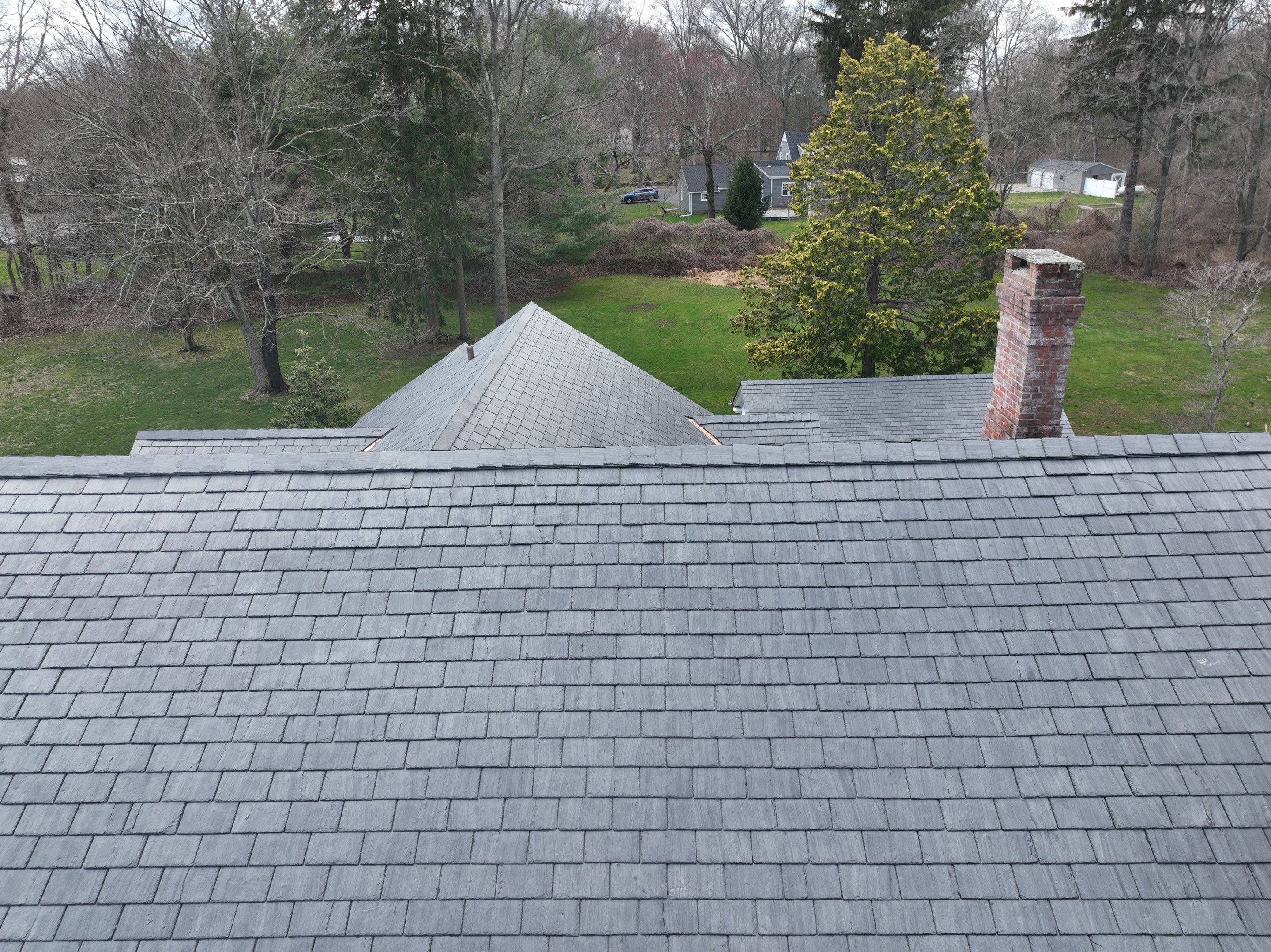 Residential Roofing Installation using Vermont Slate by A Plus Exterior