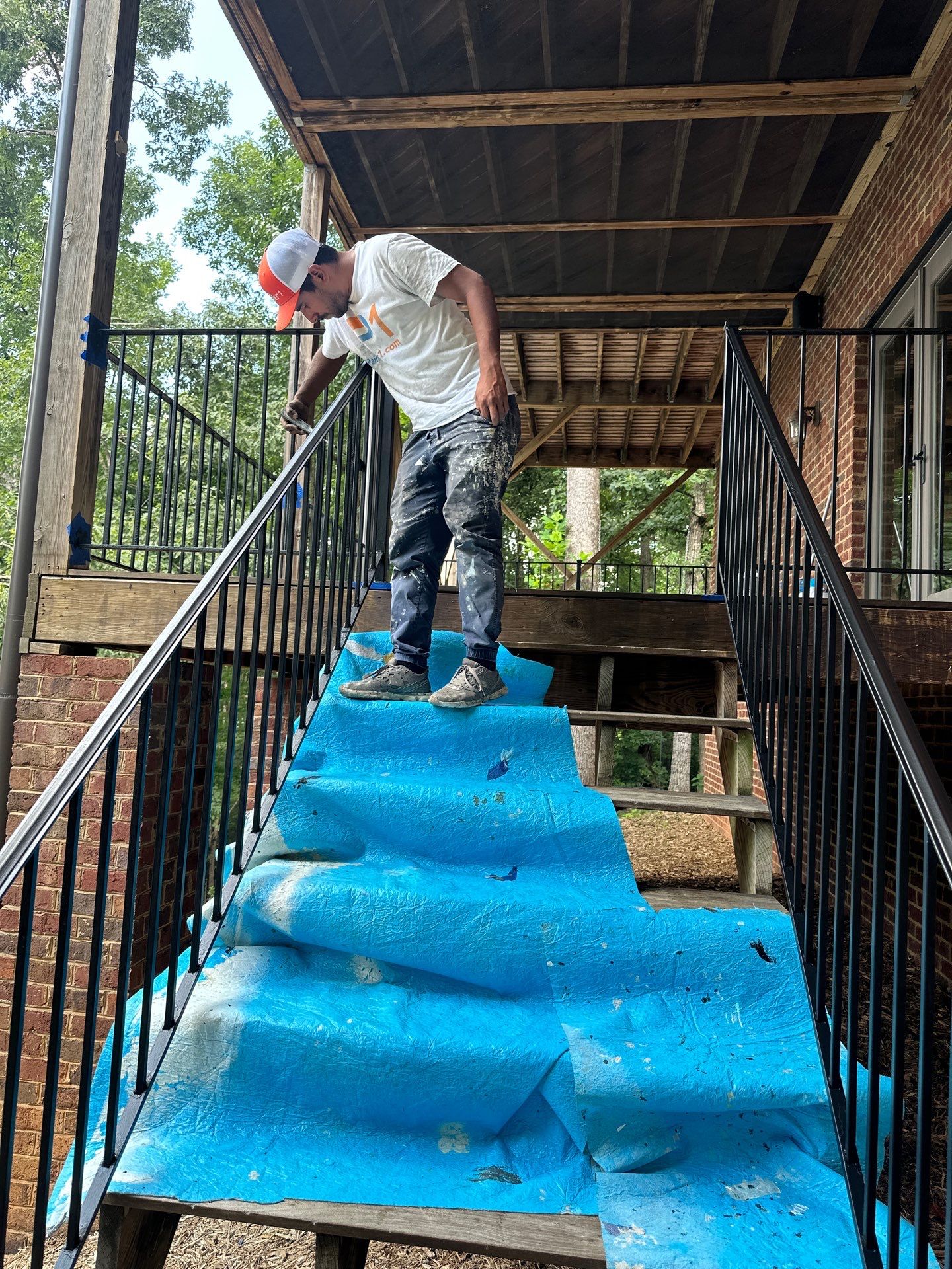 Wood Deck Refinishing and Black Metal Railing Upgrade in Travelers Rest by Painter1