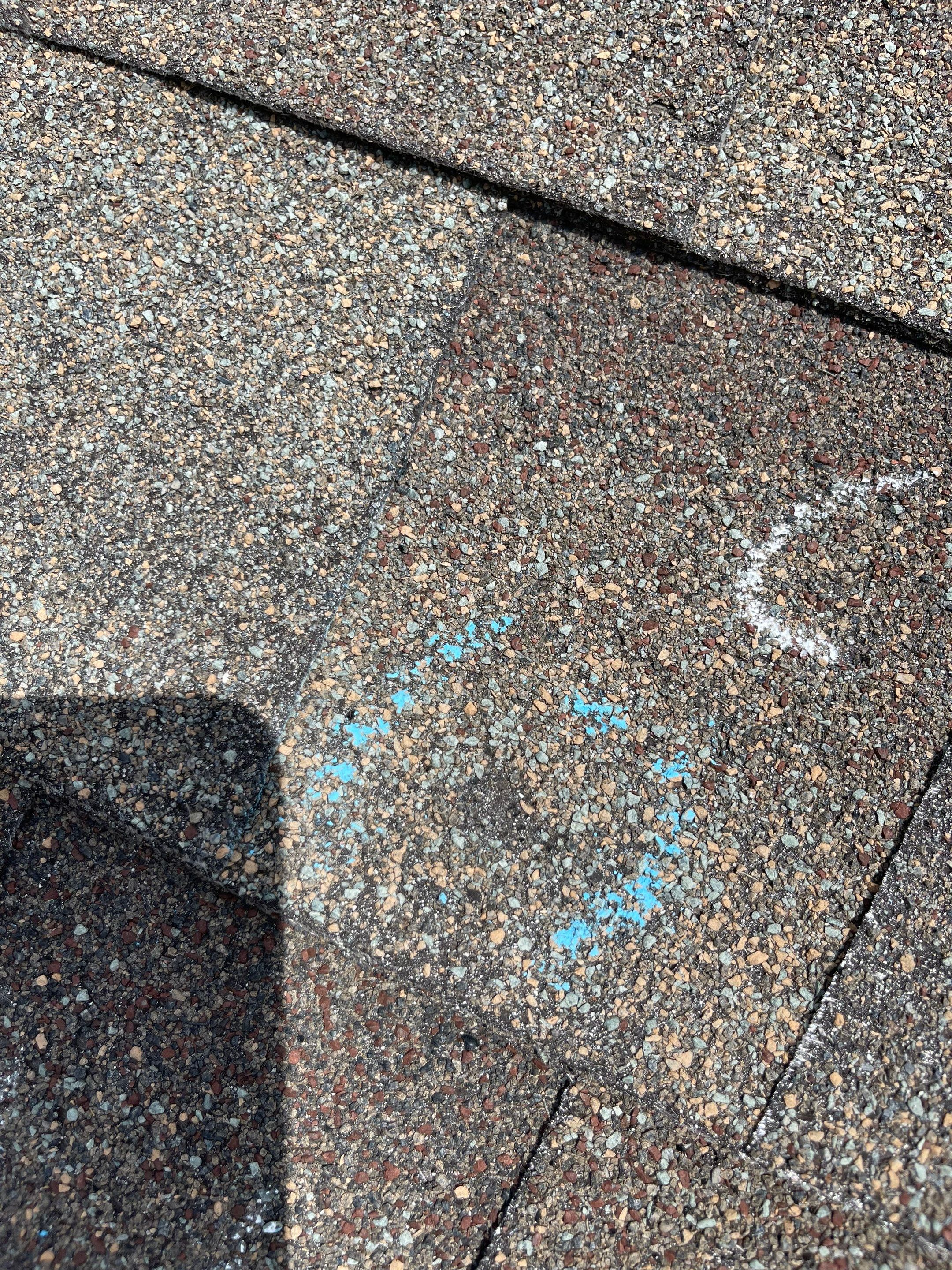 Hail Damage on a Roofing System by Icon Roofing And Construction 