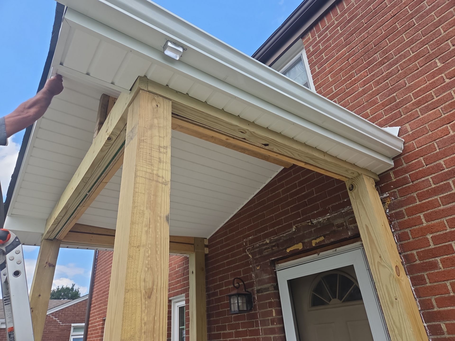 Concret and roof build  by Cousins Roofing Siding & Decks