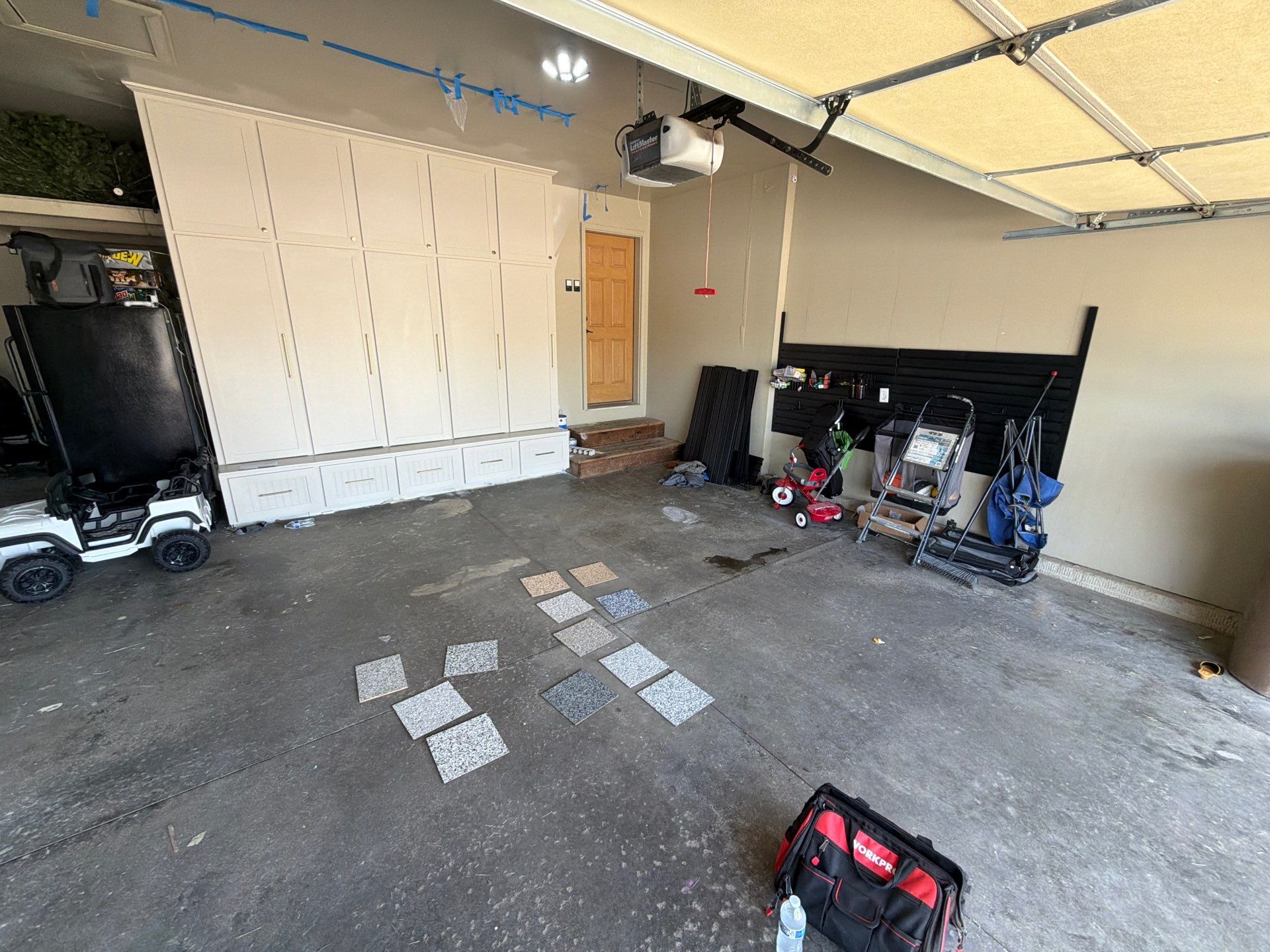 Cabin FEver Flake Garage Floor Coating Installation in Sioux Falls by Select Painting, Coatings & Garage Cabinets