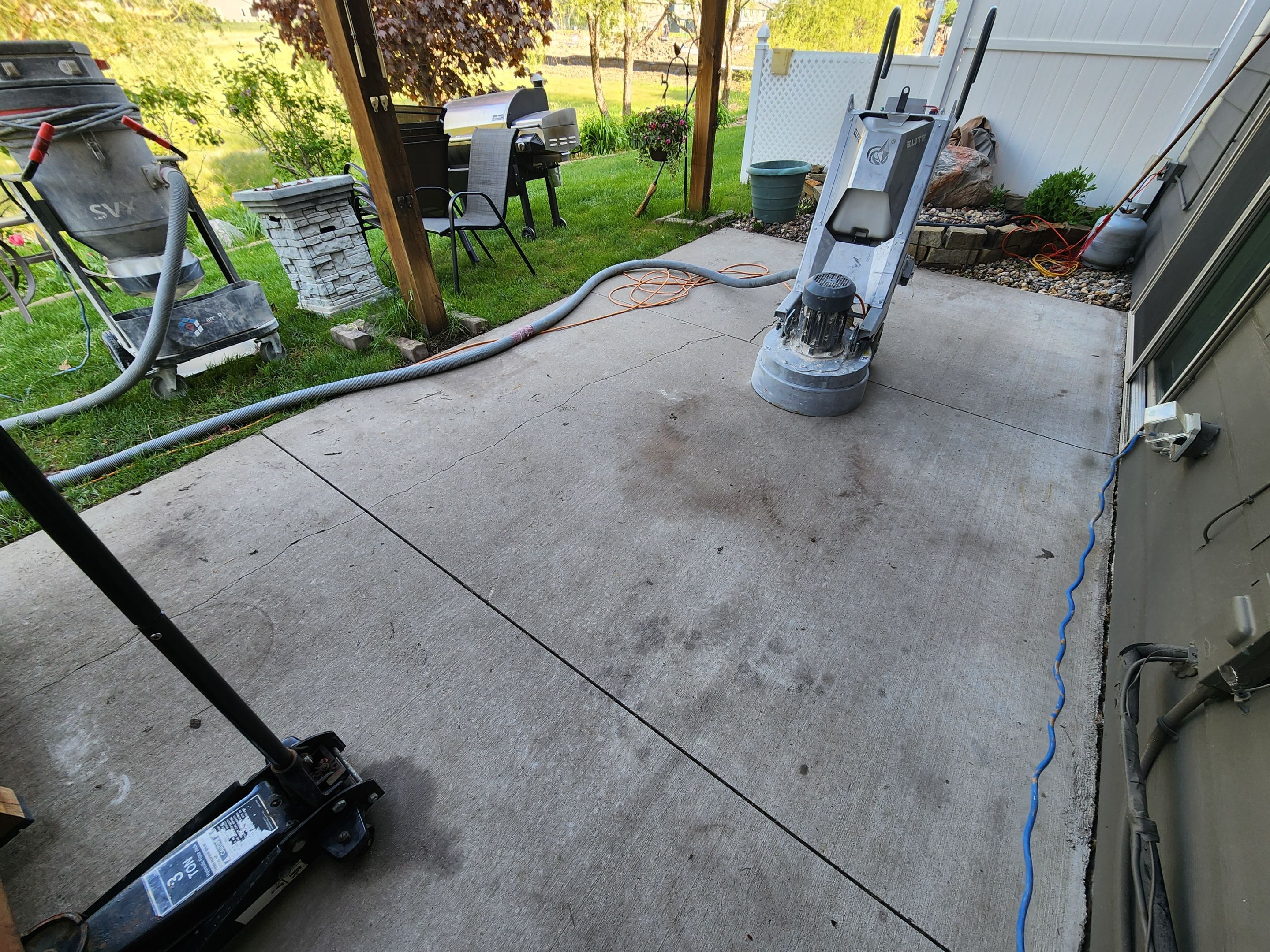 Coyote Flake Concrete Coating for Sioux Falls Patio by Select Painting, Coatings & Garage Cabinets
