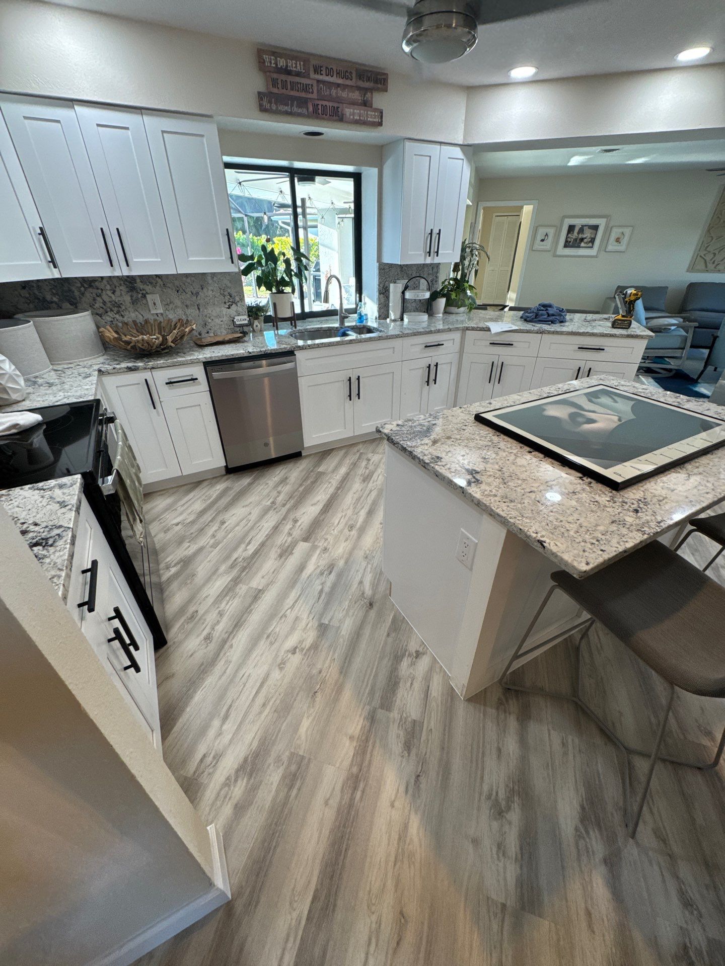 LVP Install in living room/ Kitchen by Vrmmm Flooring