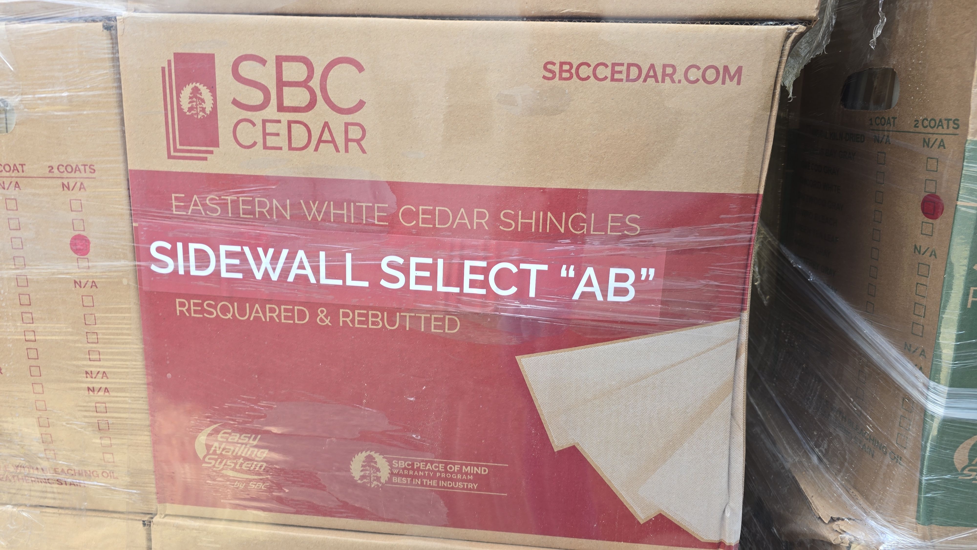 White cedar shingles and windows in Wayland, MA by UBrothers Construction