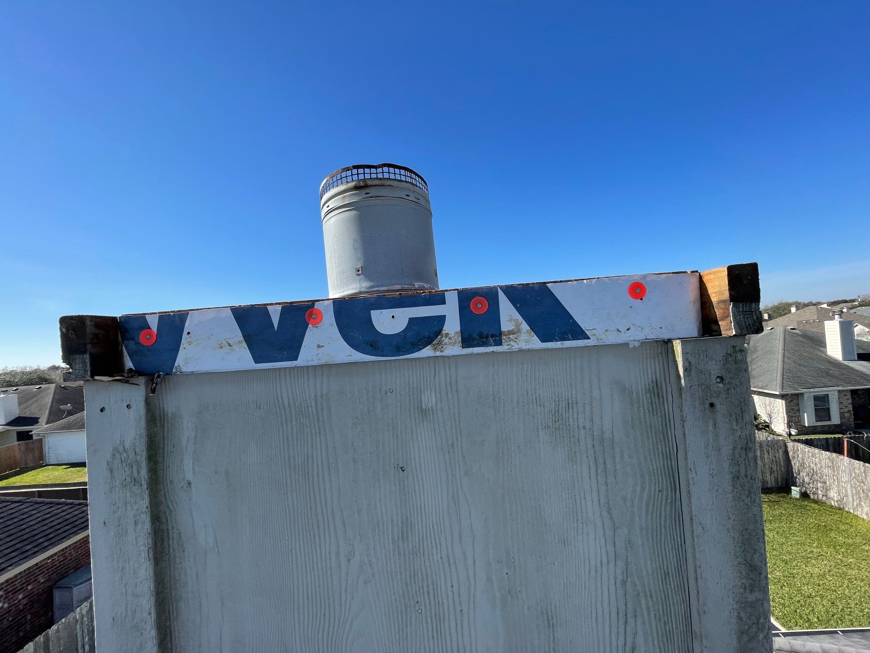 Residential Roofing Repair Replacing Chimney Cap by Lighthouse Roofing