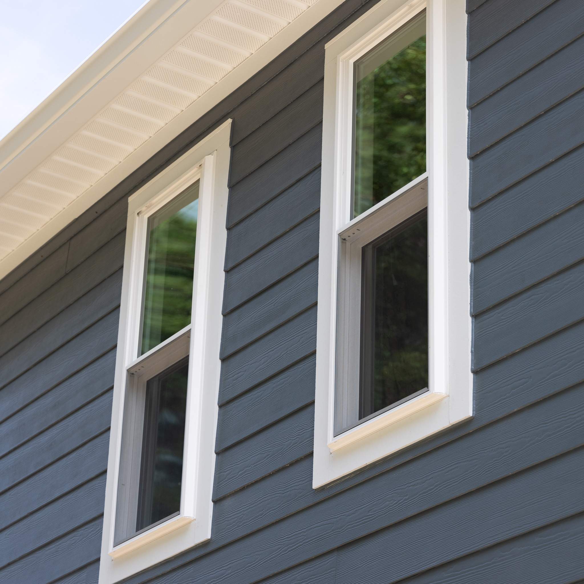 Evening Blue Hardie + Windows by Freedom Exteriors