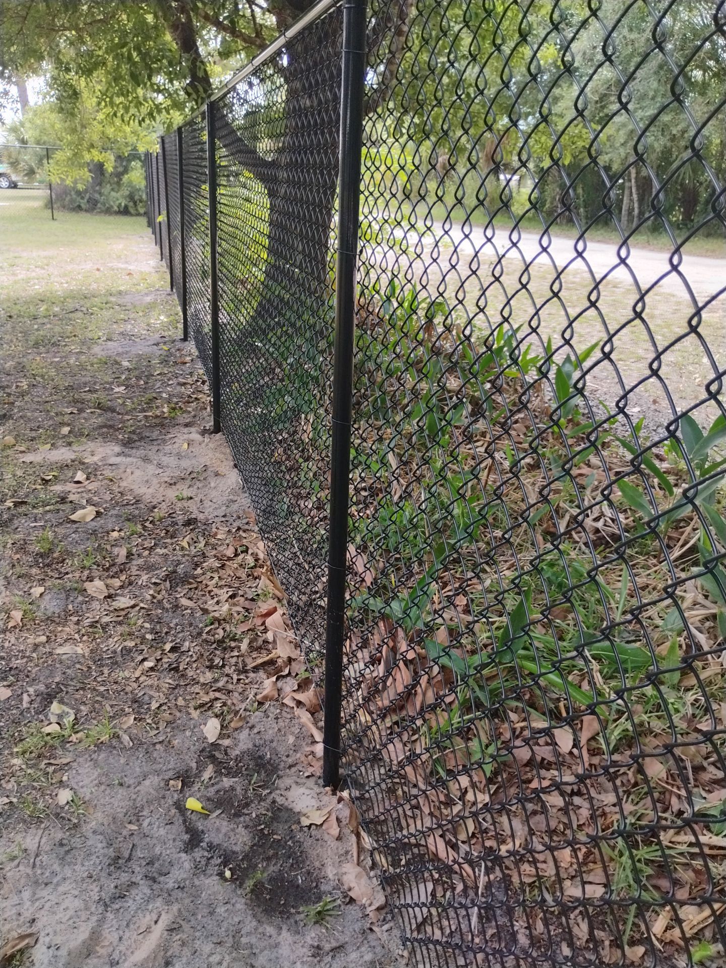 Black Vinyl Chain Link Fence Installation in Arcadia Florida by True Fence LLC