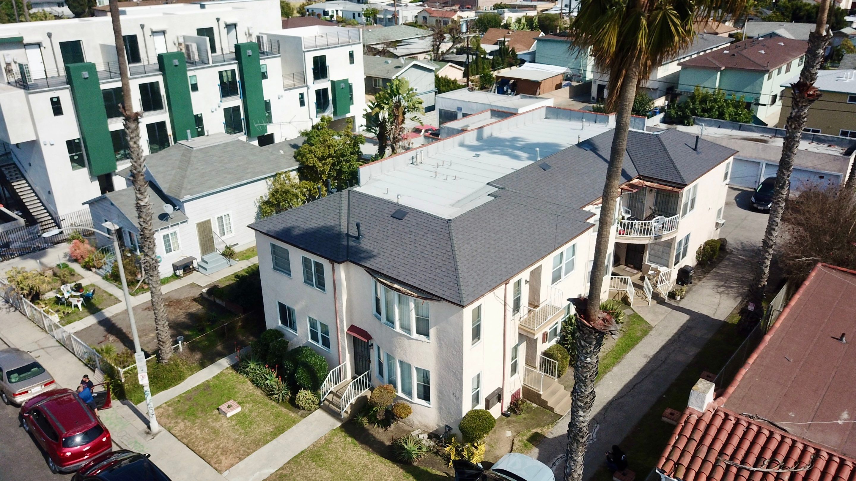 Apartment Building Roofing Installation using CertainTeed GTA Modified Bitument System by Hull Brothers Roofing