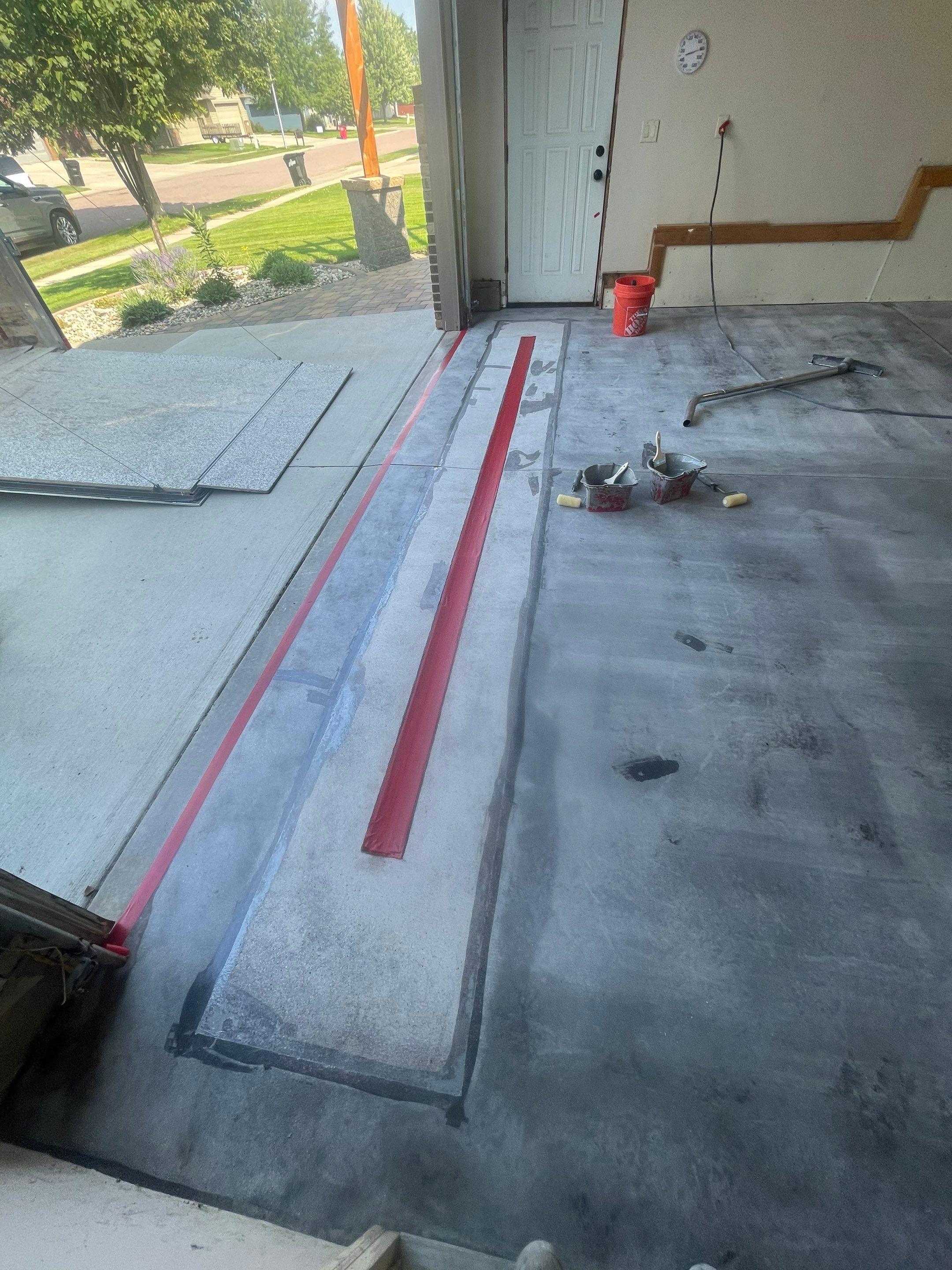 Multi-Stall Garage Floor Coating Installation in Sioux Falls by Select Painting, Coatings & Garage Cabinets
