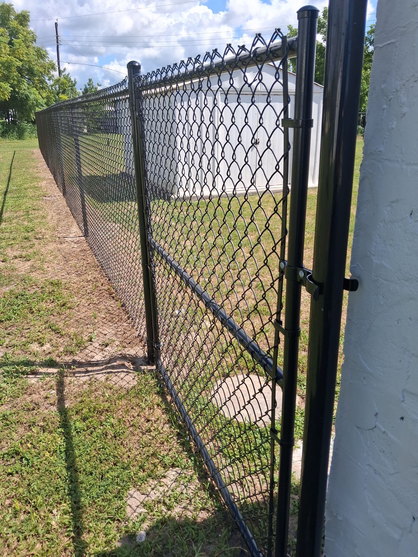 Black Chain Link Fence Installation for Residential Backyard in Port Charlotte by True Fence LLC