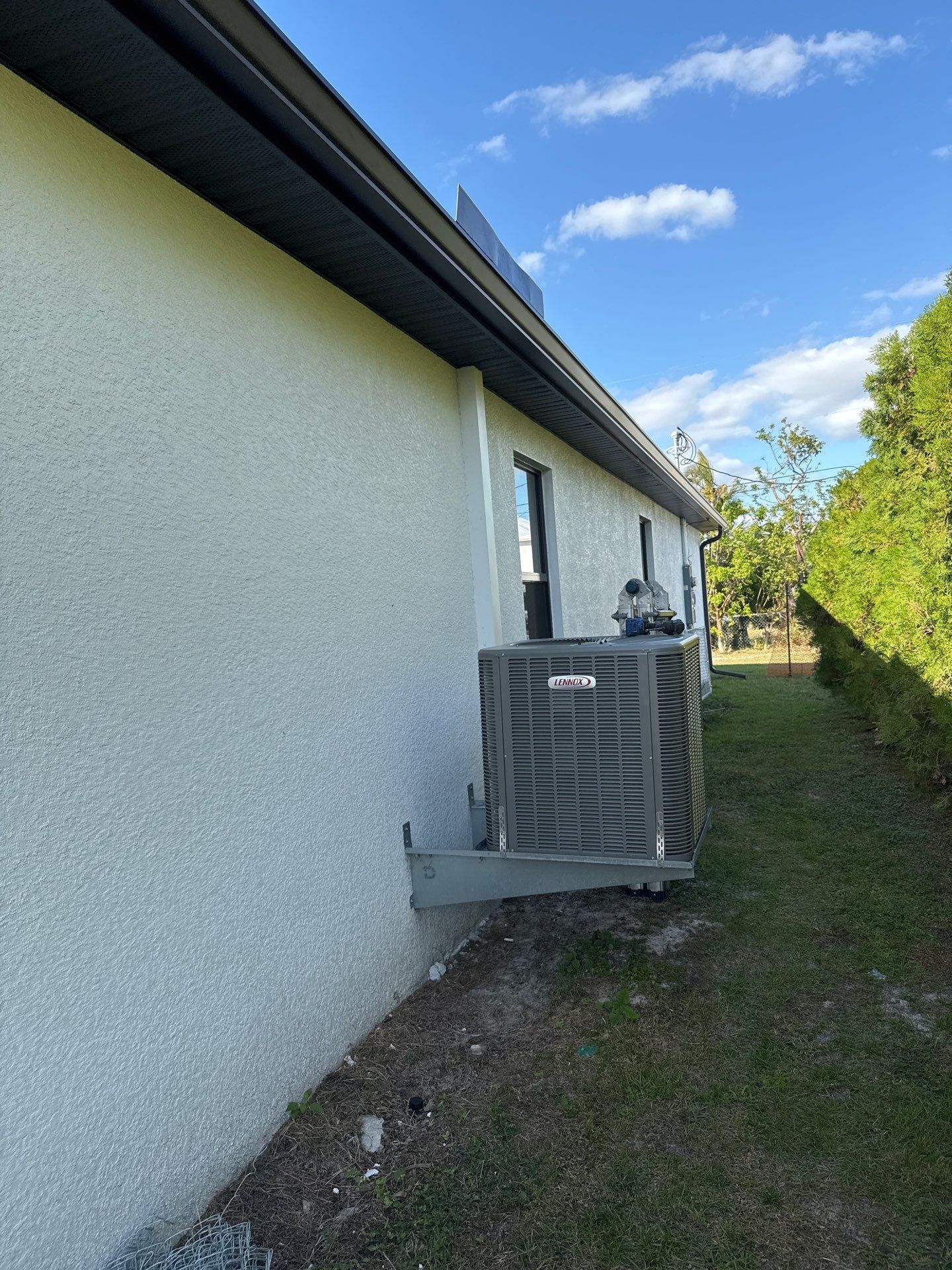 Dark Seamless Gutters and Downspouts in Cape Coral FL by Gutter Professors