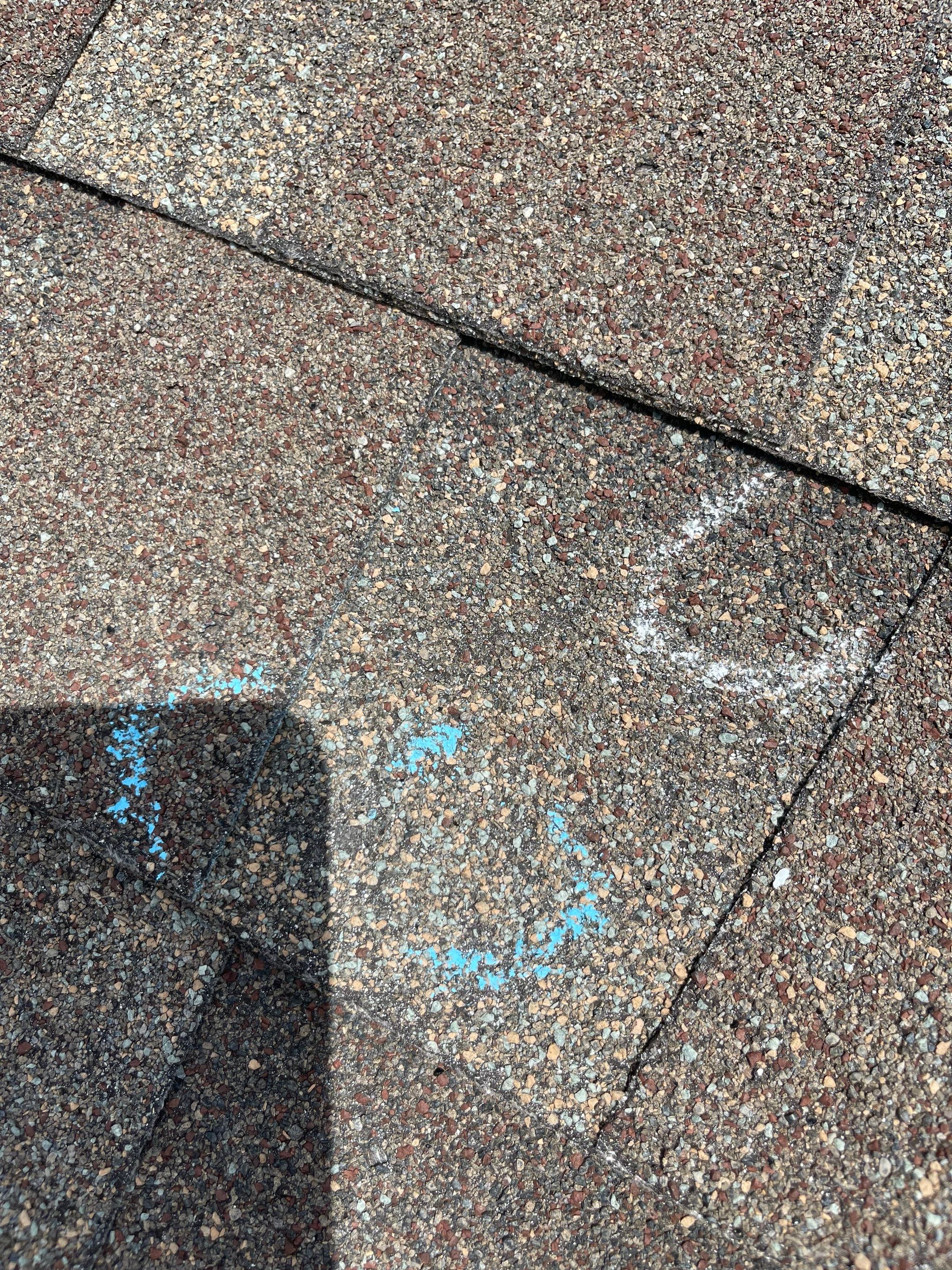 Hail Damage on a Roofing System by Icon Roofing And Construction 