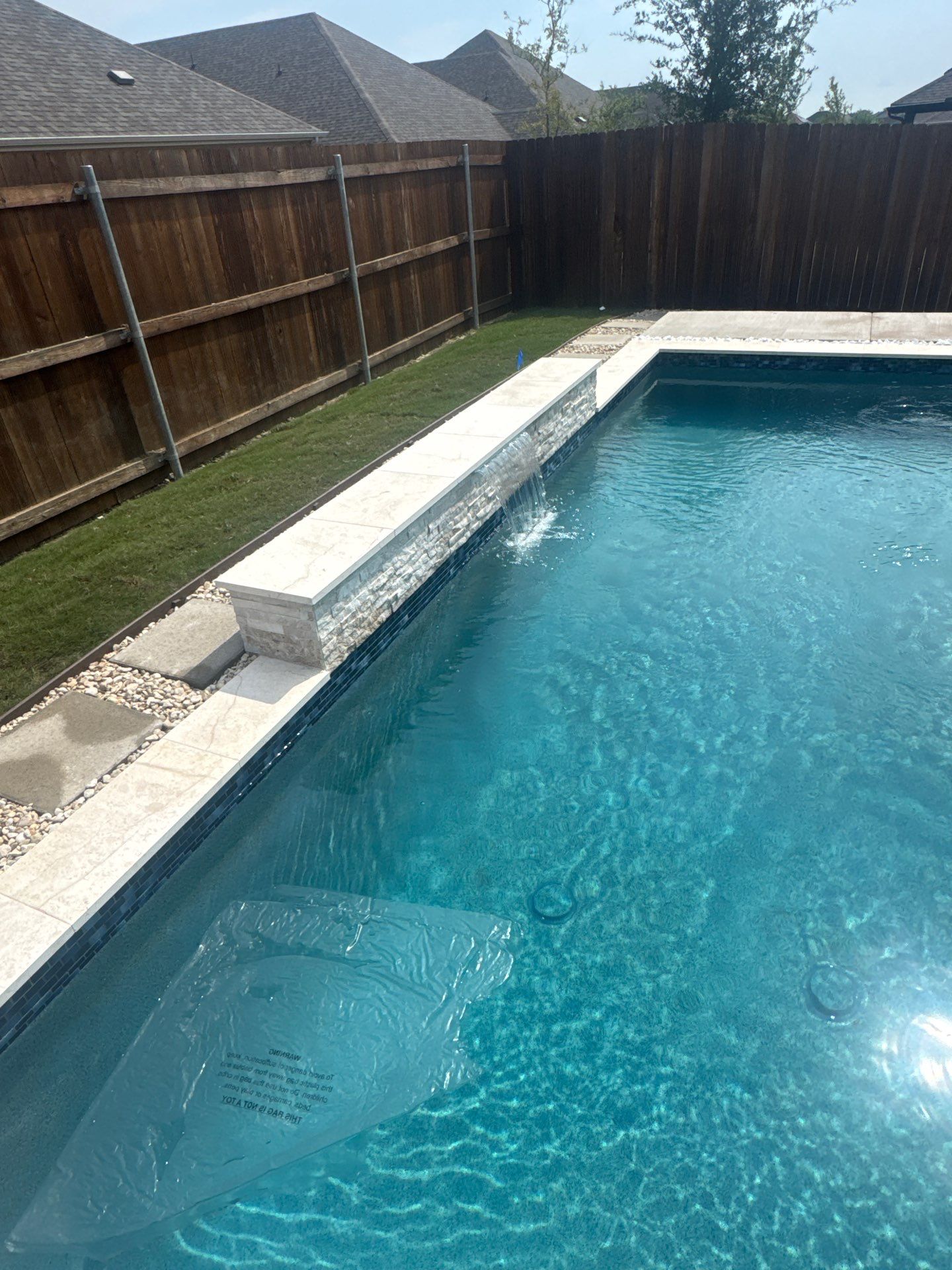 Sleek Geometric Pool with Tanning Ledge and Turf by Pinnacle Pools and Spas - DFW