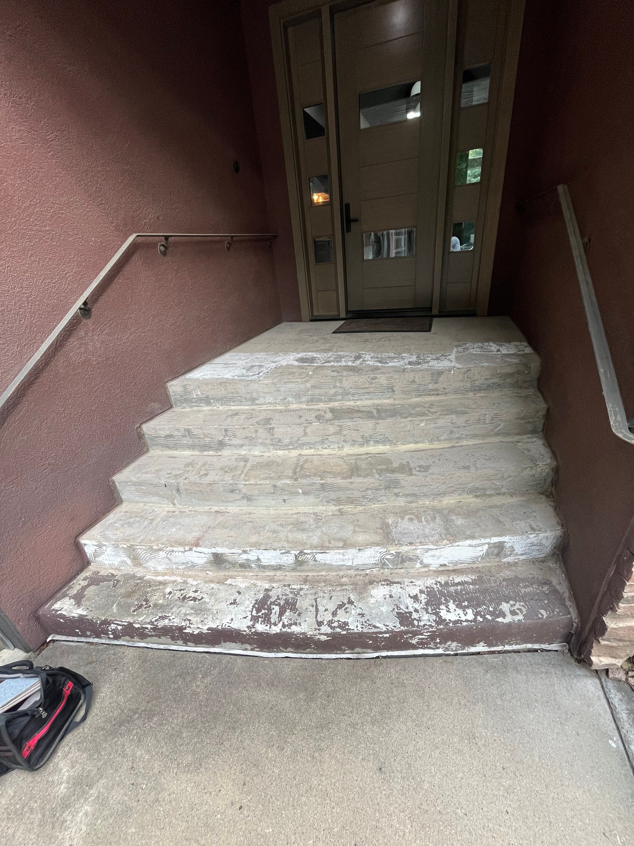 Garage Floor and Entry Step Concrete Coating in Sioux Falls by Select Painting, Coatings & Garage Cabinets