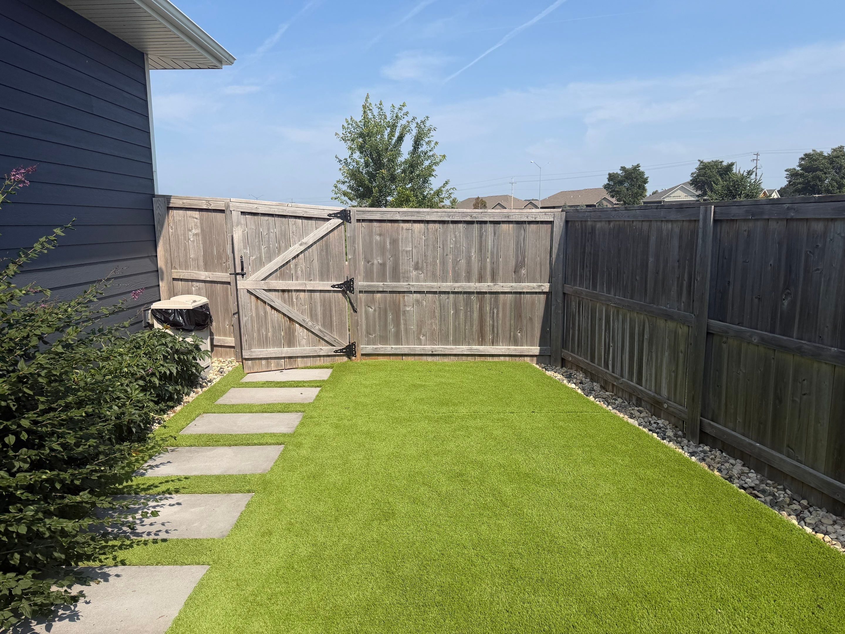 Custom Privacy Fence and Paver Patio Installation in Sioux Falls by Select Painting, Coatings & Garage Cabinets