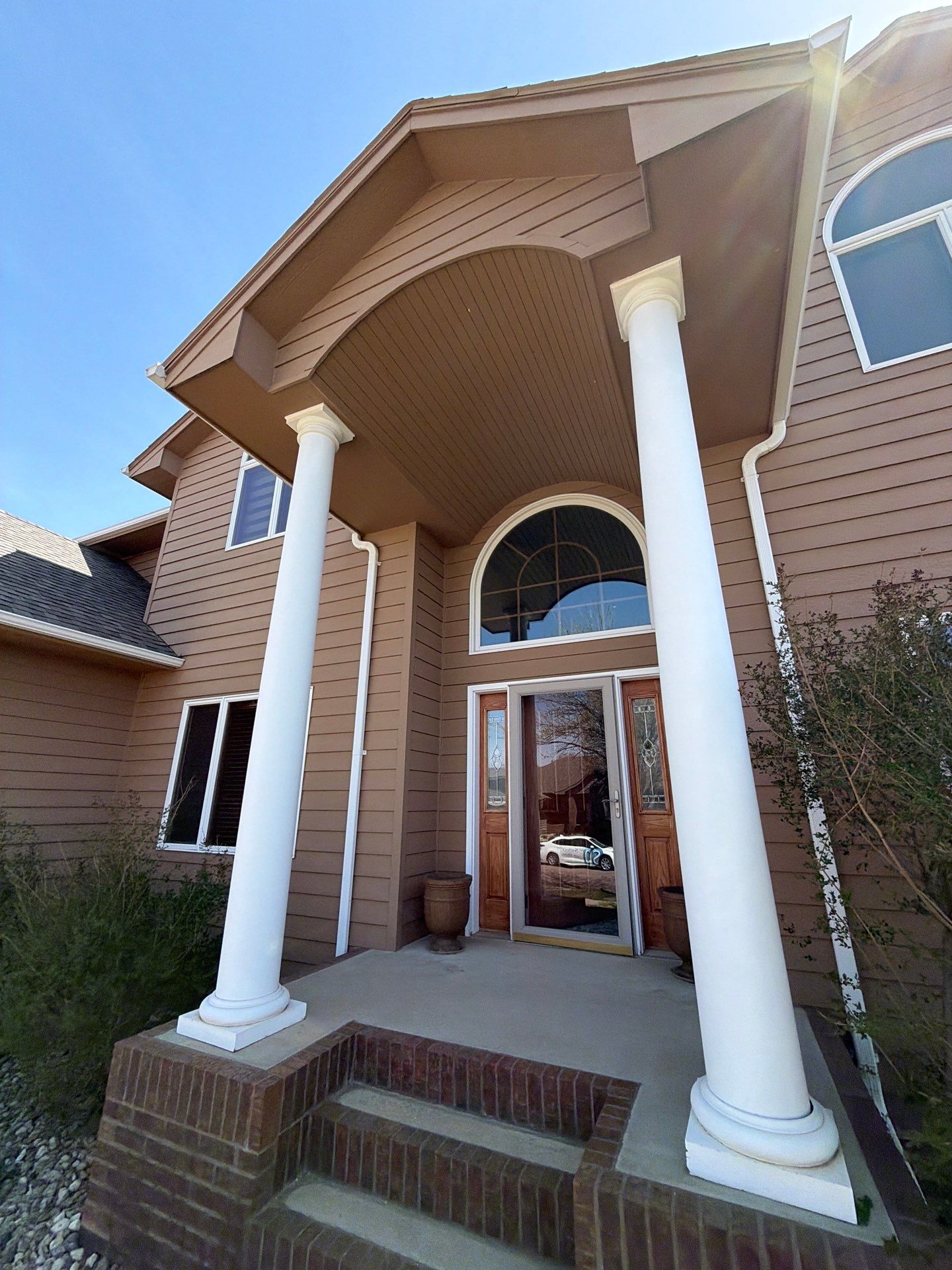 Full Exterior House Painting and Deck Staining in Sioux Falls by Select Painting, Coatings & Garage Cabinets