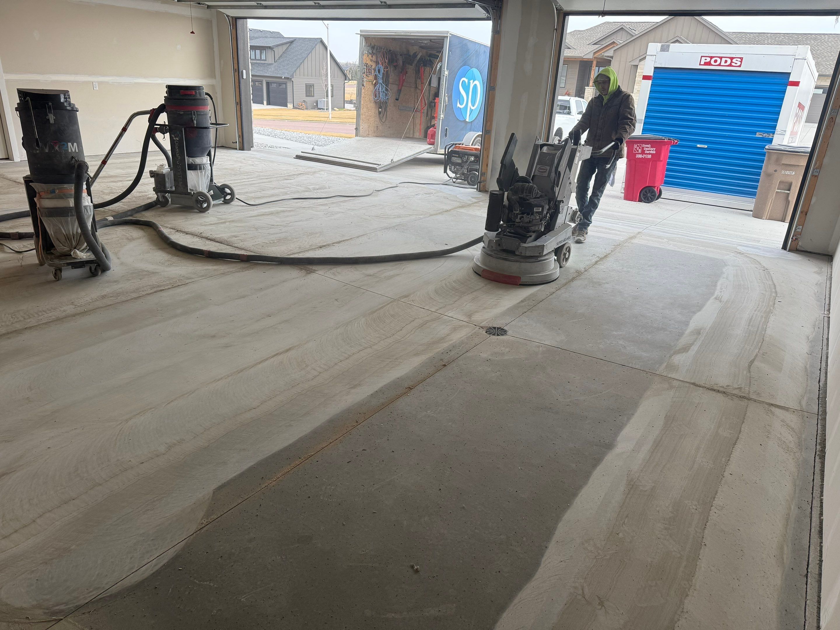 Grey Speckled Epoxy Floor Coating for Sioux Falls Garage by Select Painting, Coatings & Garage Cabinets