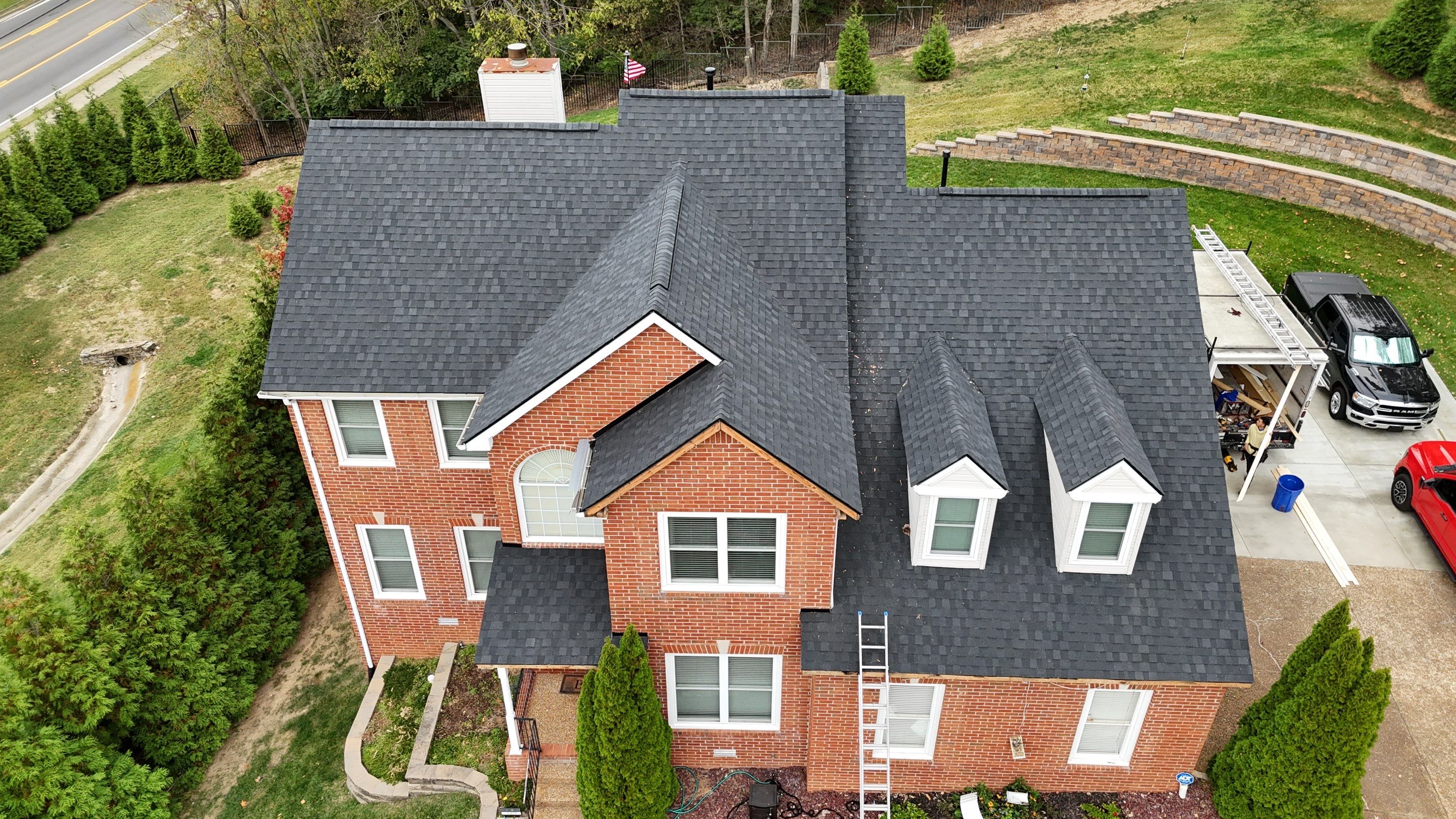 Charcoal Black Re-Roof & Gutters by Royal House LLC