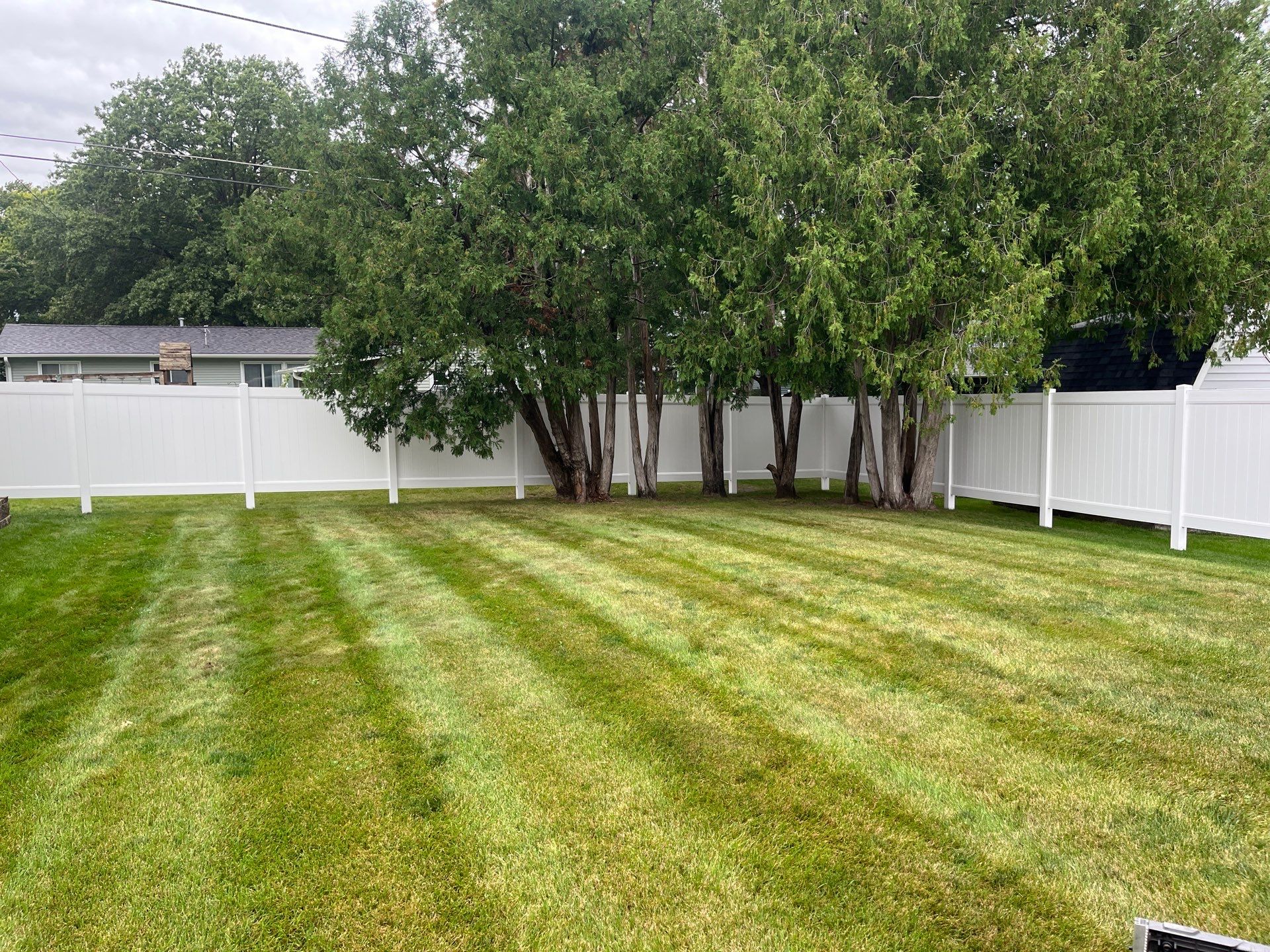 Residential White Vinyl Privacy Fence Enclosure in Waterloo by Perfect Picket Fence and Stain