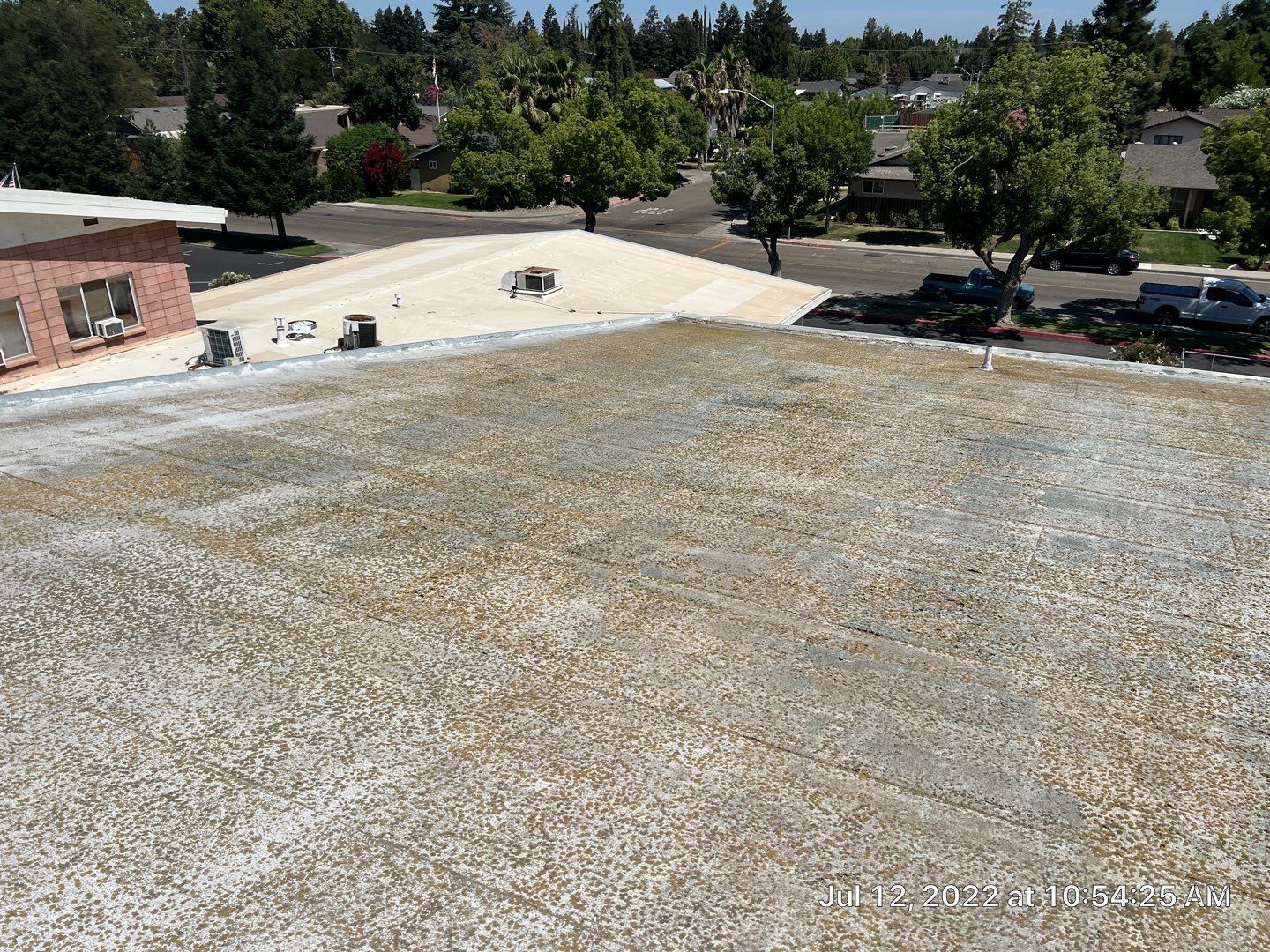 MR Roofing system using Benchmark/PUMA XL coatings over TPO single-ply roofing by Straight Edge Roofing Inc
