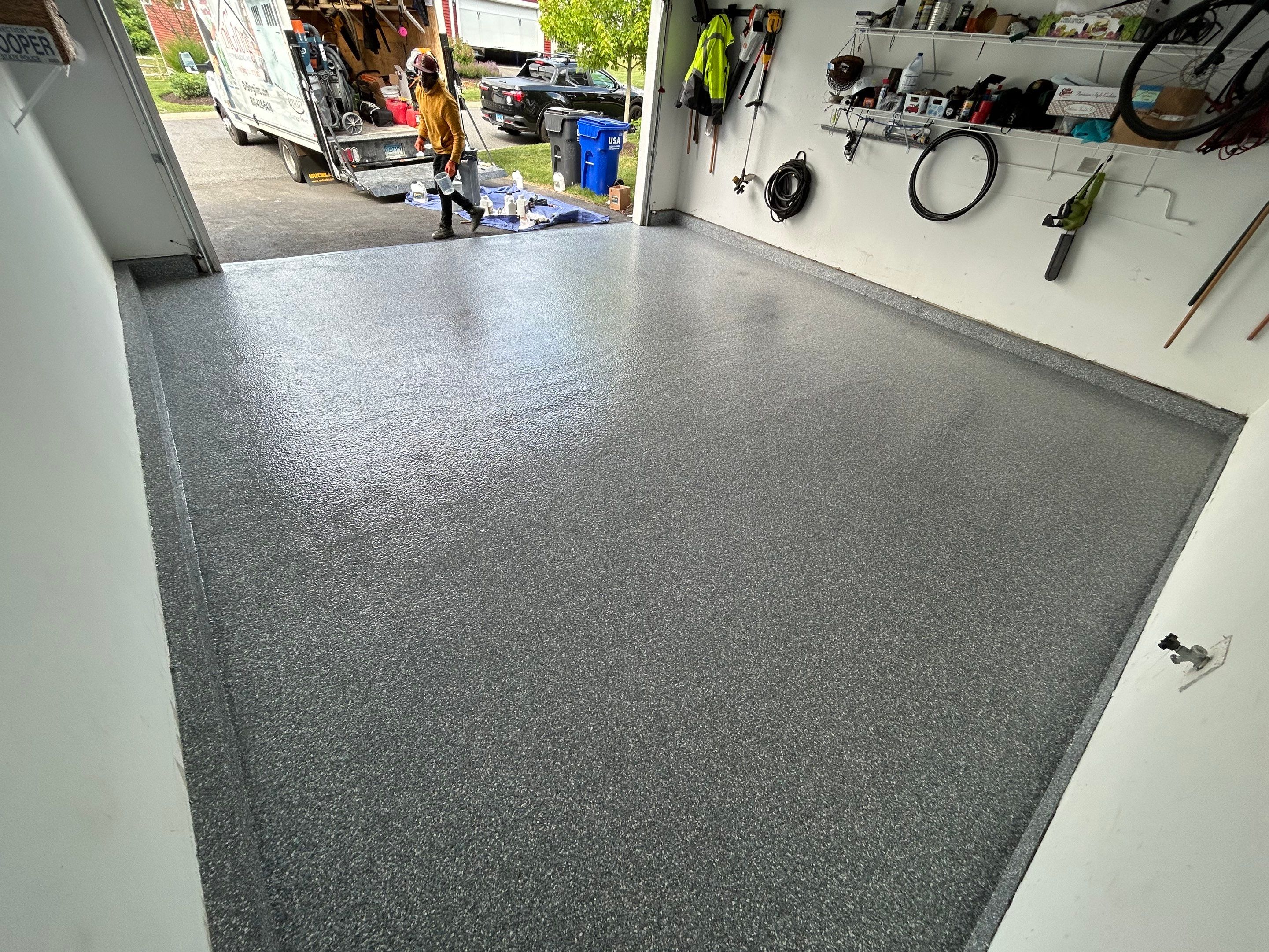 Garage Floor Coating Transformation by DiGiorgi Roofing and Siding Inc