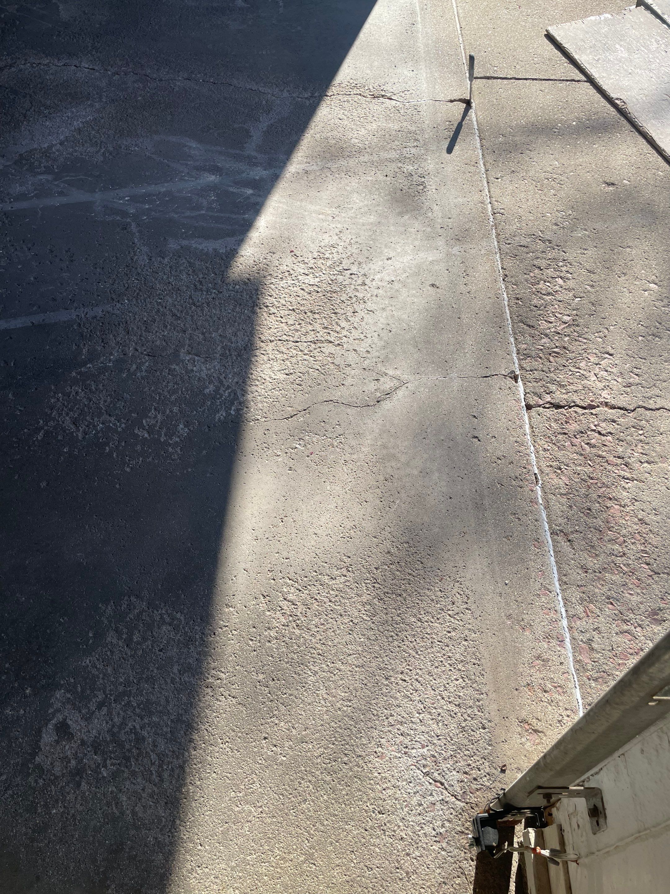 Yankton Garage Floor Restoration with Gray Speckled Epoxy Coating by Select Painting, Coatings & Garage Cabinets