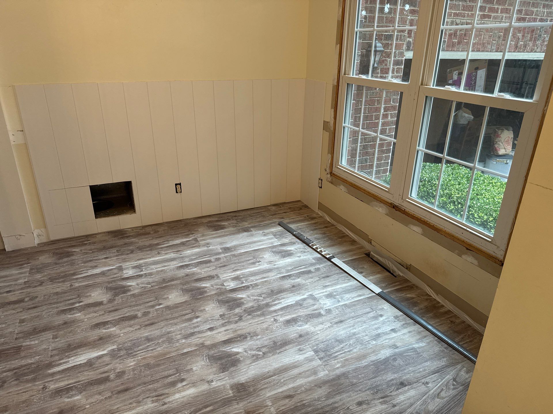 Front Room Transformed into a Waterproof Pet Room by A Step Above Handy LLC 