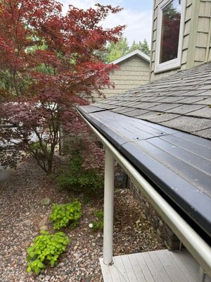 Gutter Helmet Protection System for Suttons Bay Home with Cedar Siding