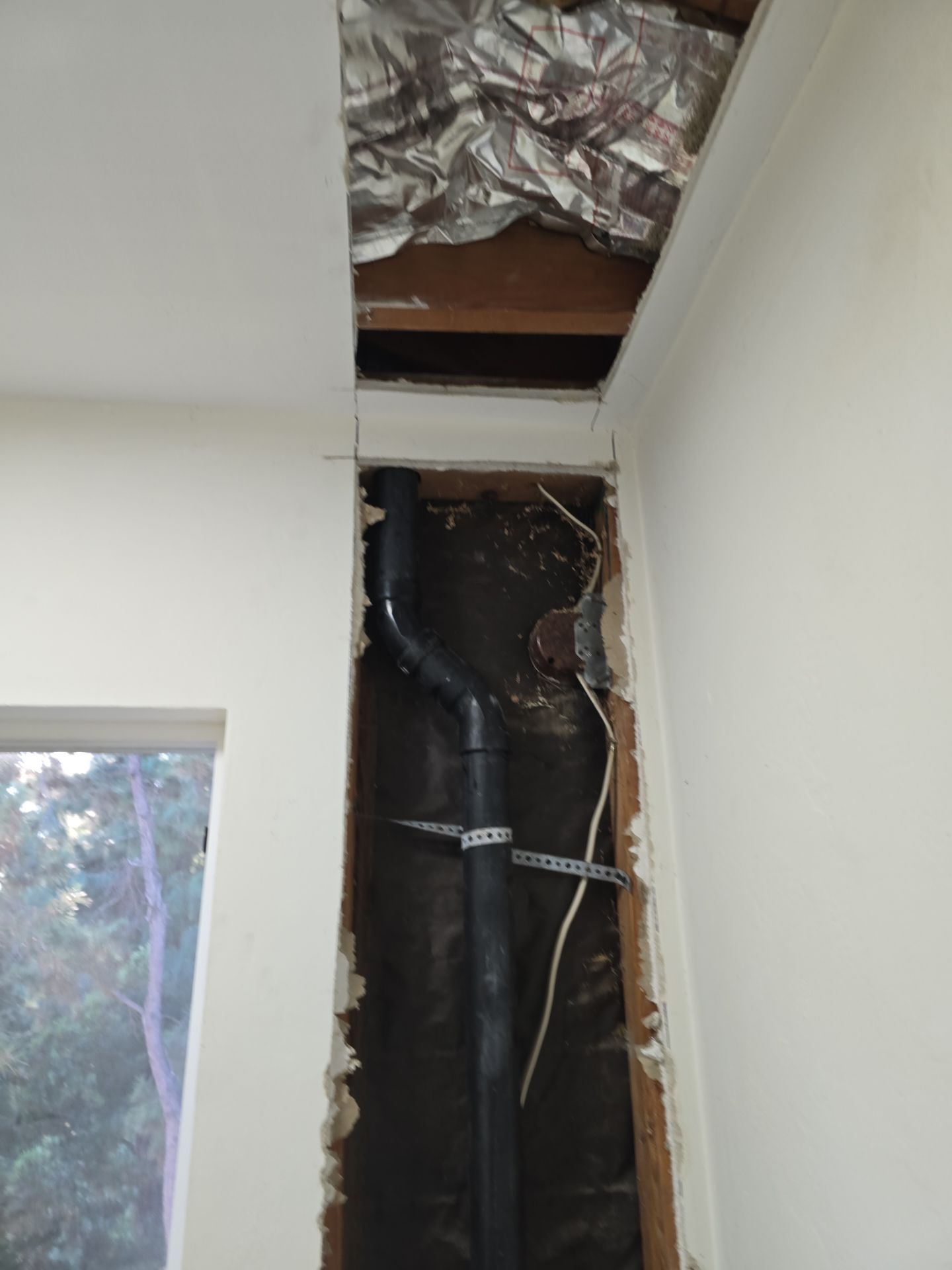 Installation of New Tall Black Piping (Wall to Ceiling) & Underground Piping by Us Plumbing