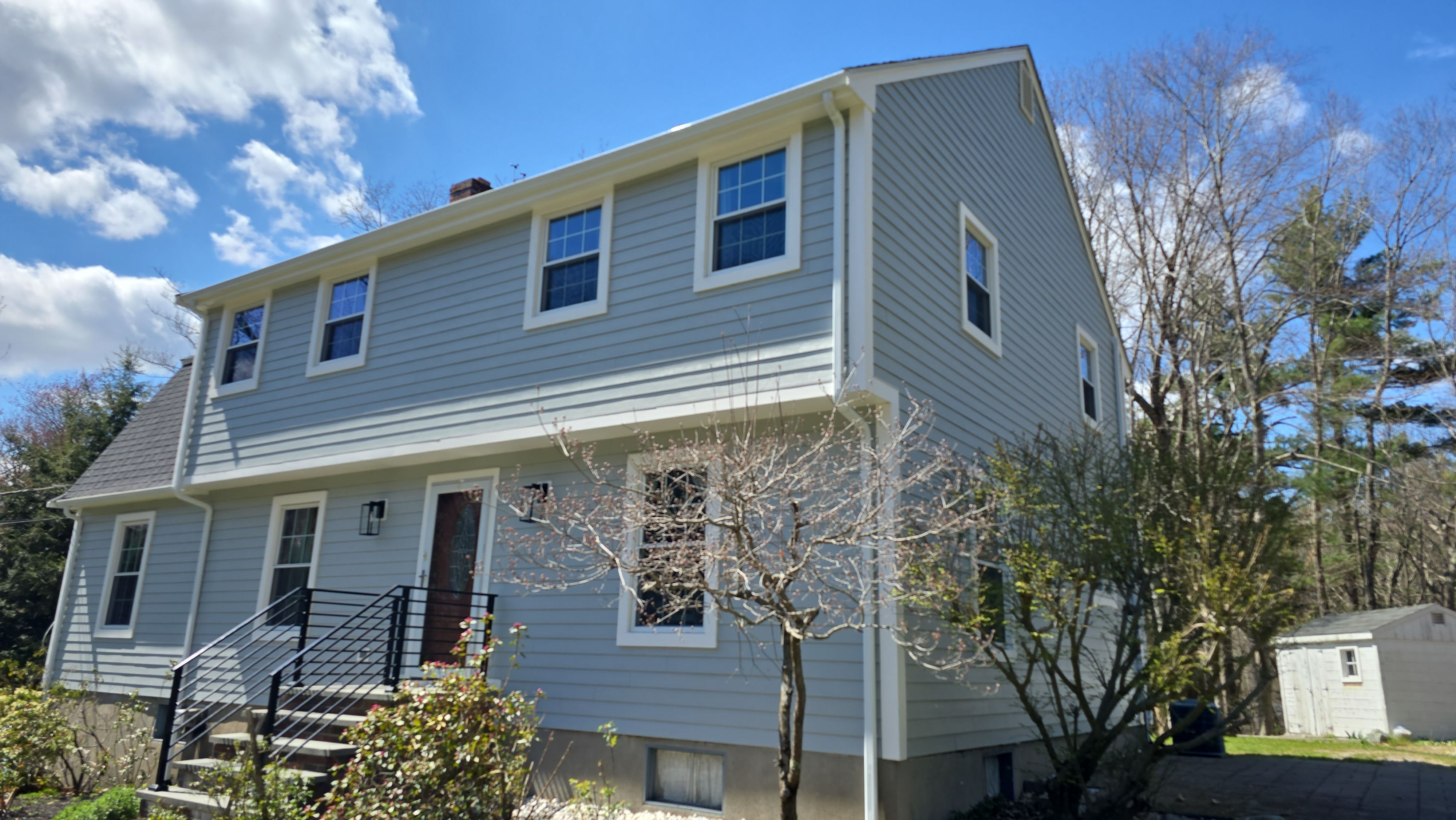Custom window trim work and siding replacement in Dover, MA by UBrothers Construction