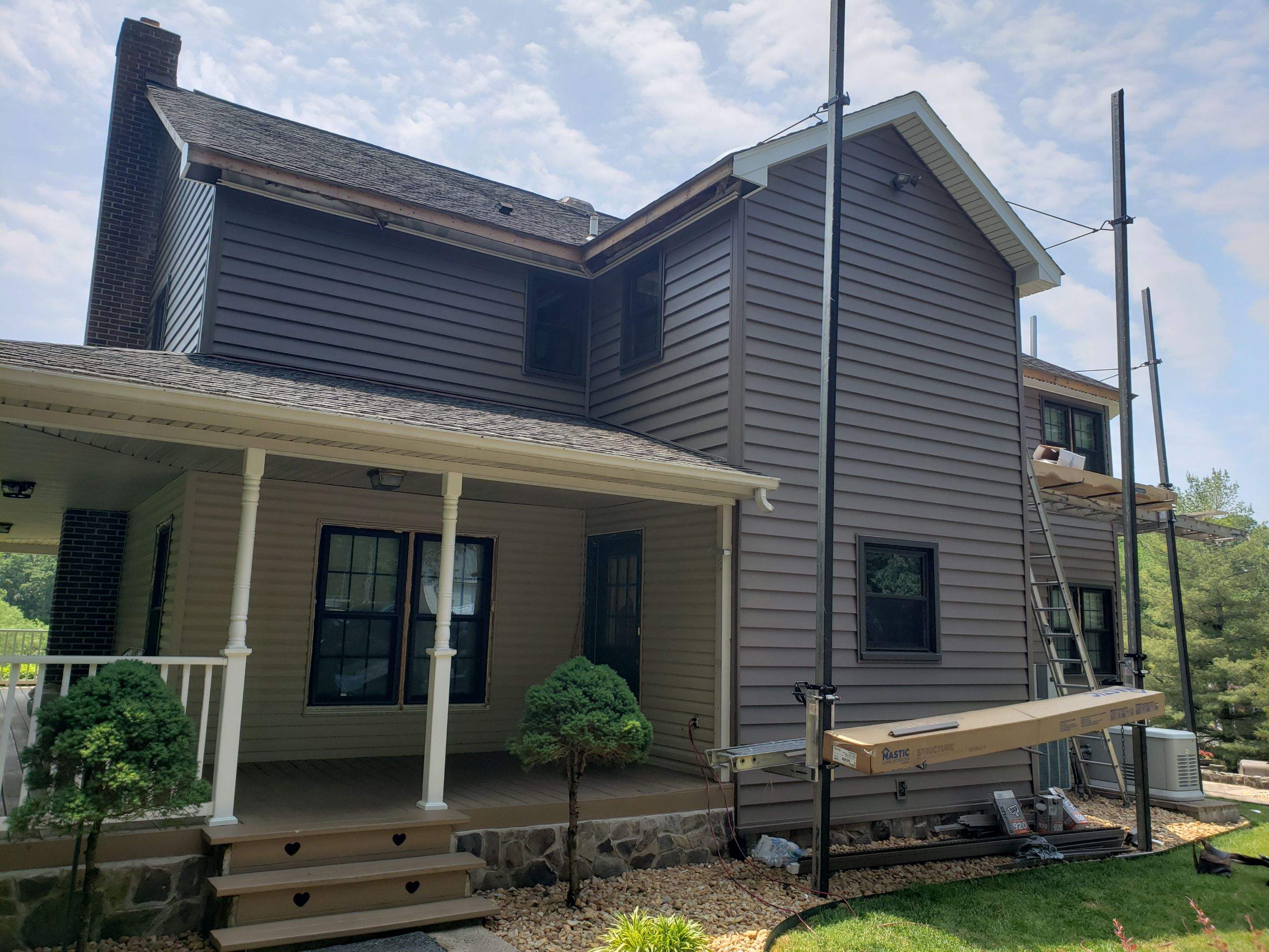 Exterior remodel including window replacement by American Home Contractors