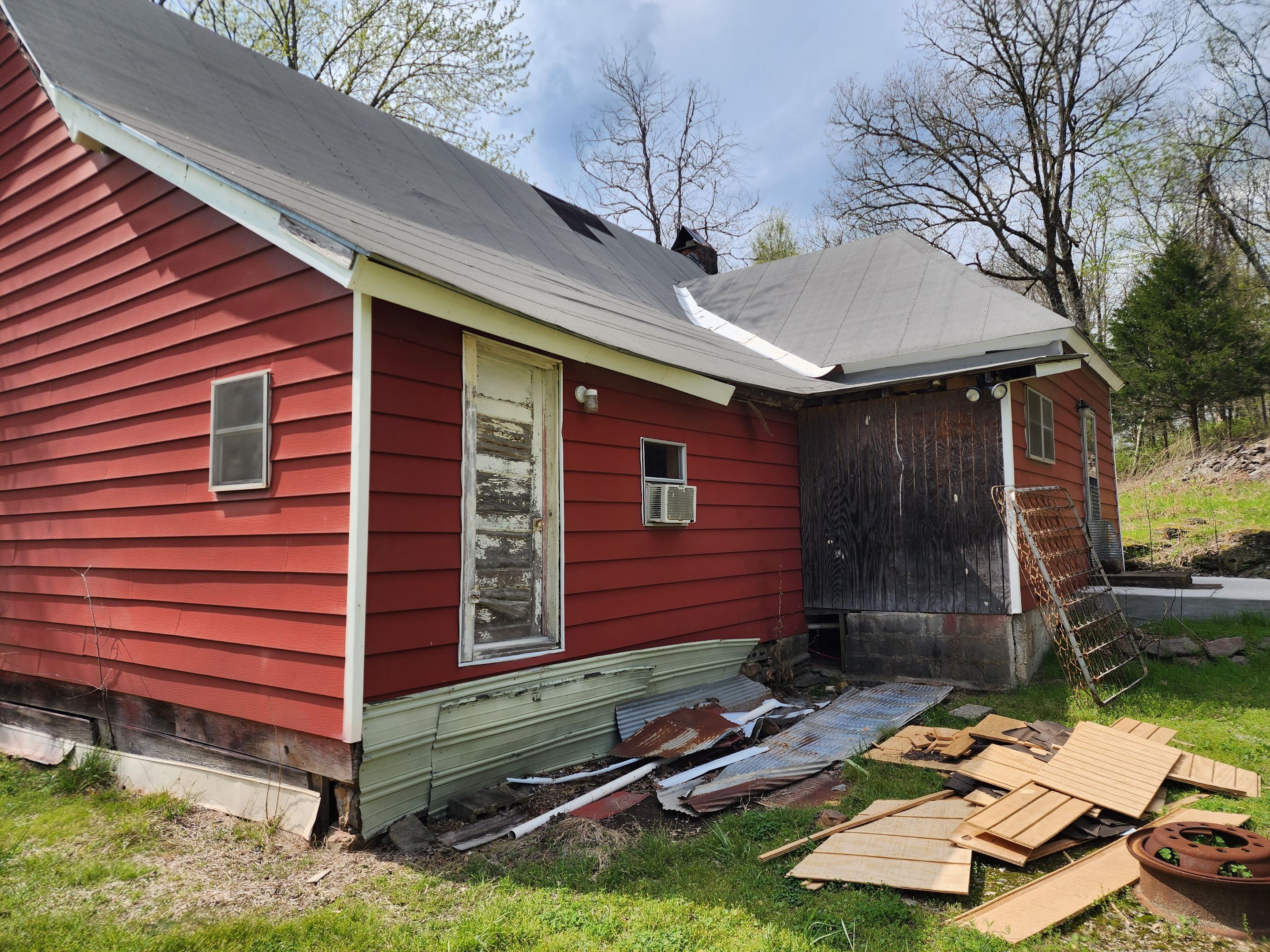 Residential Roofing Installation using 26 Gauge Colored Panels by Hostetler Roofing