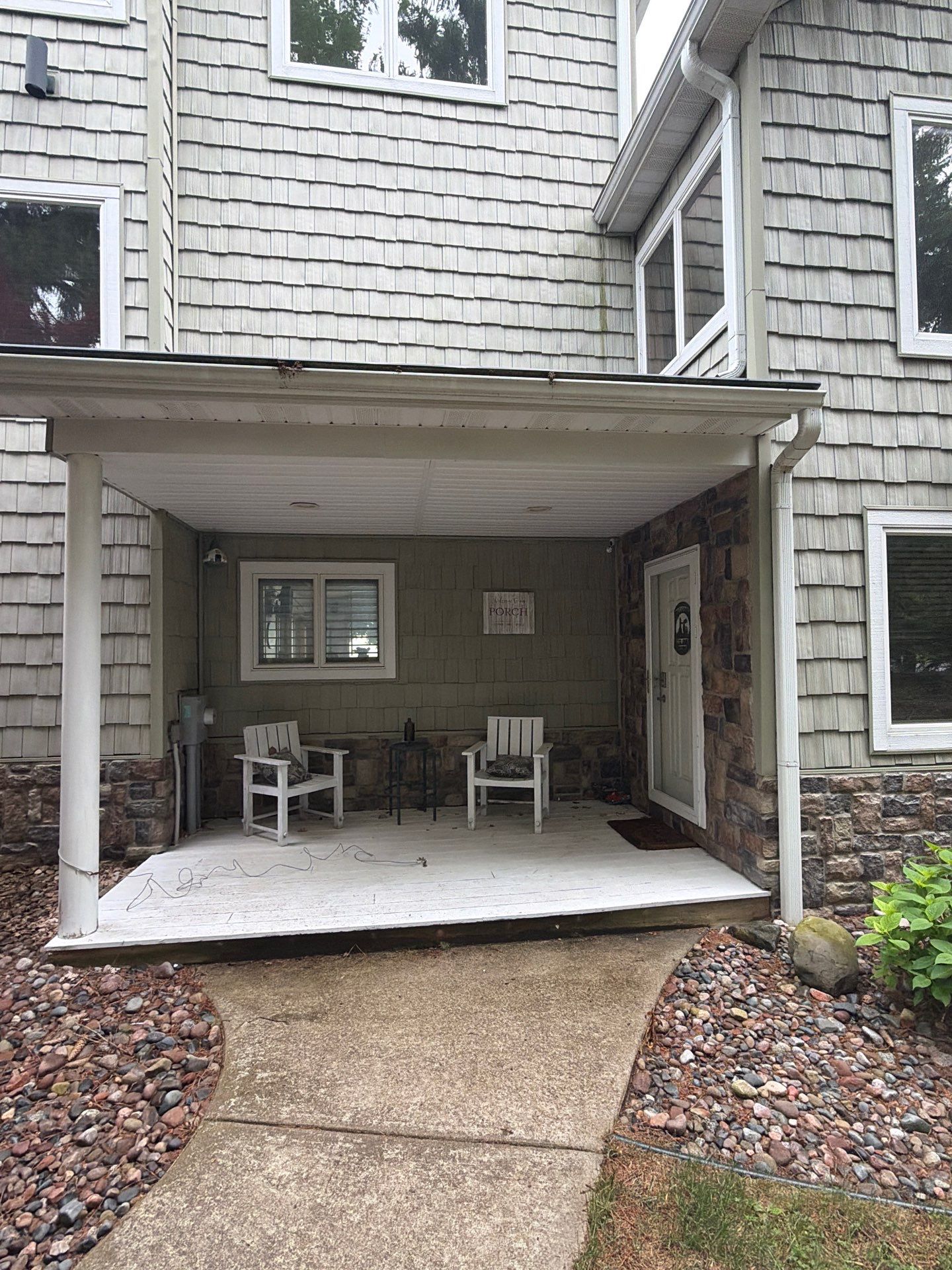Gutter Helmet Protection System for Suttons Bay Home with Cedar Siding by Rainbow Seamless Systems