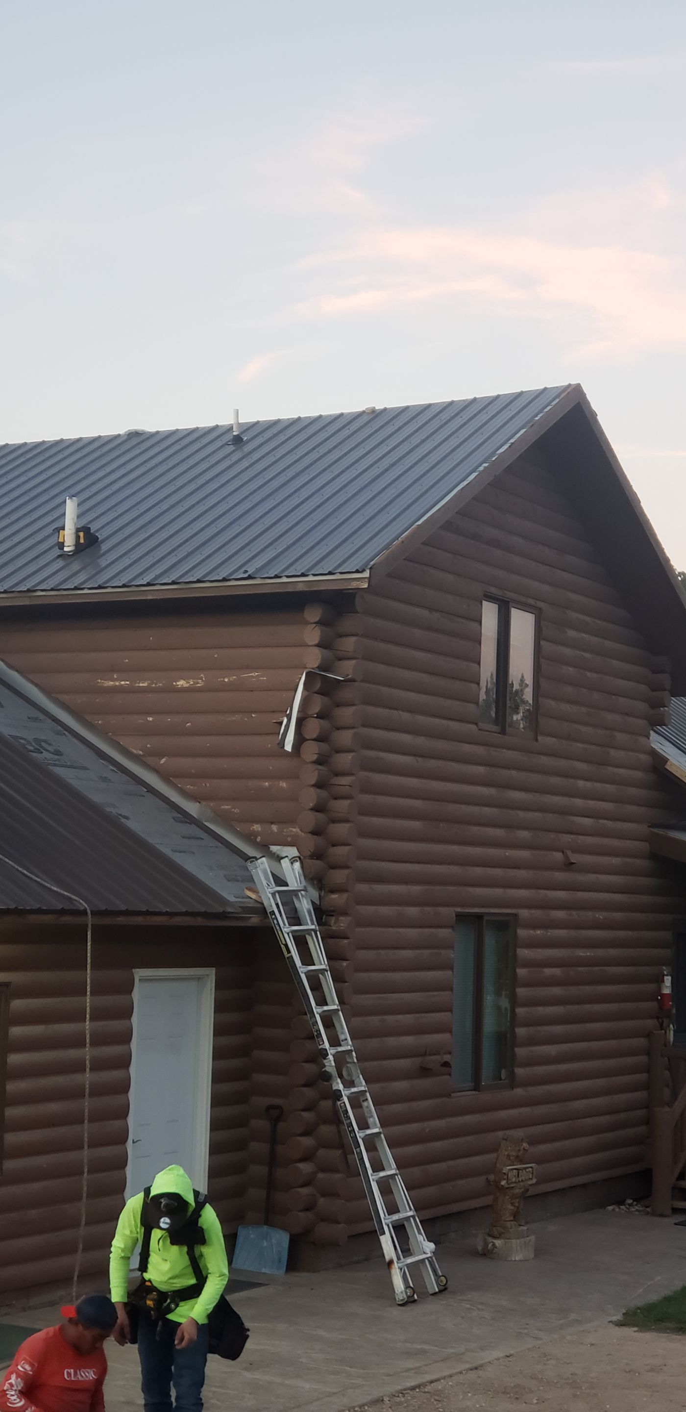 Hill Country Guest Ranch using Steel Roofing, Gutters, Log Cabin Staining by Lightning Exteriors