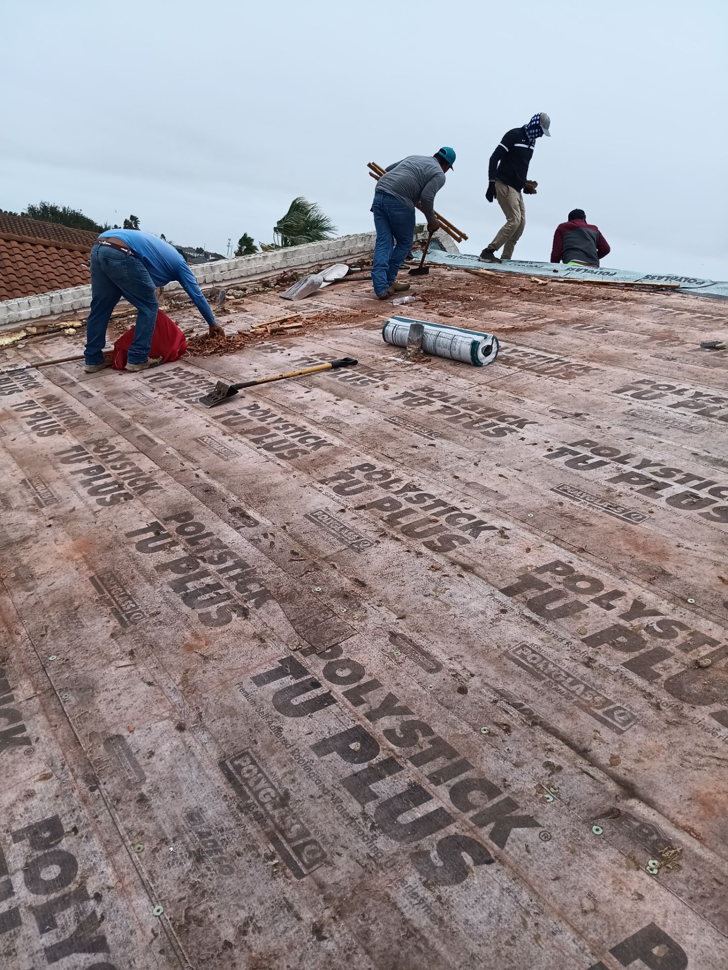 Off with the Tile and on with the TILCOR stone coated metal.  by Bayfront Roofing and Construction