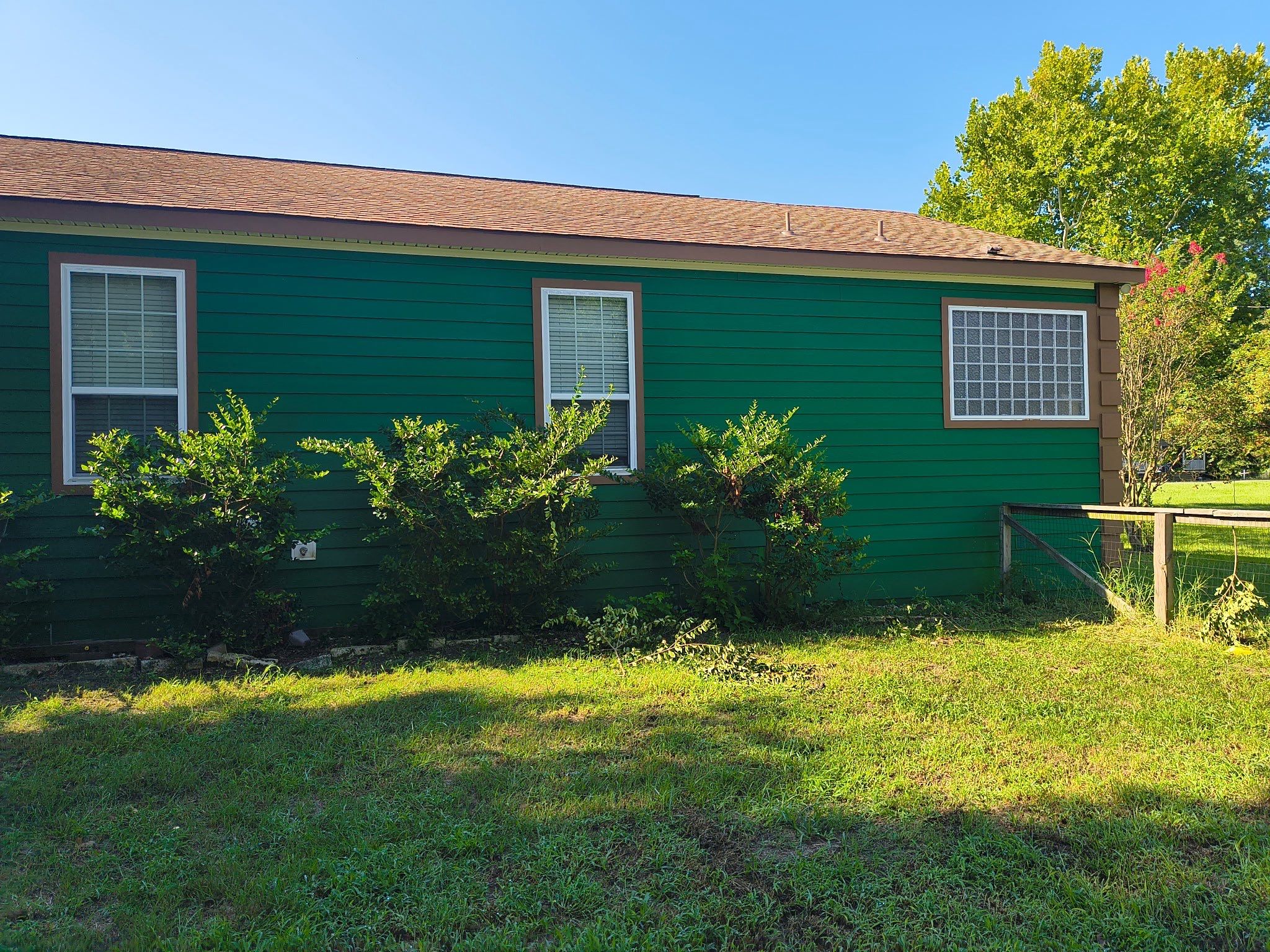 Exterior Painting in Lindale, TX | Bright Green Wood House Repaint by Quality Coats Painting