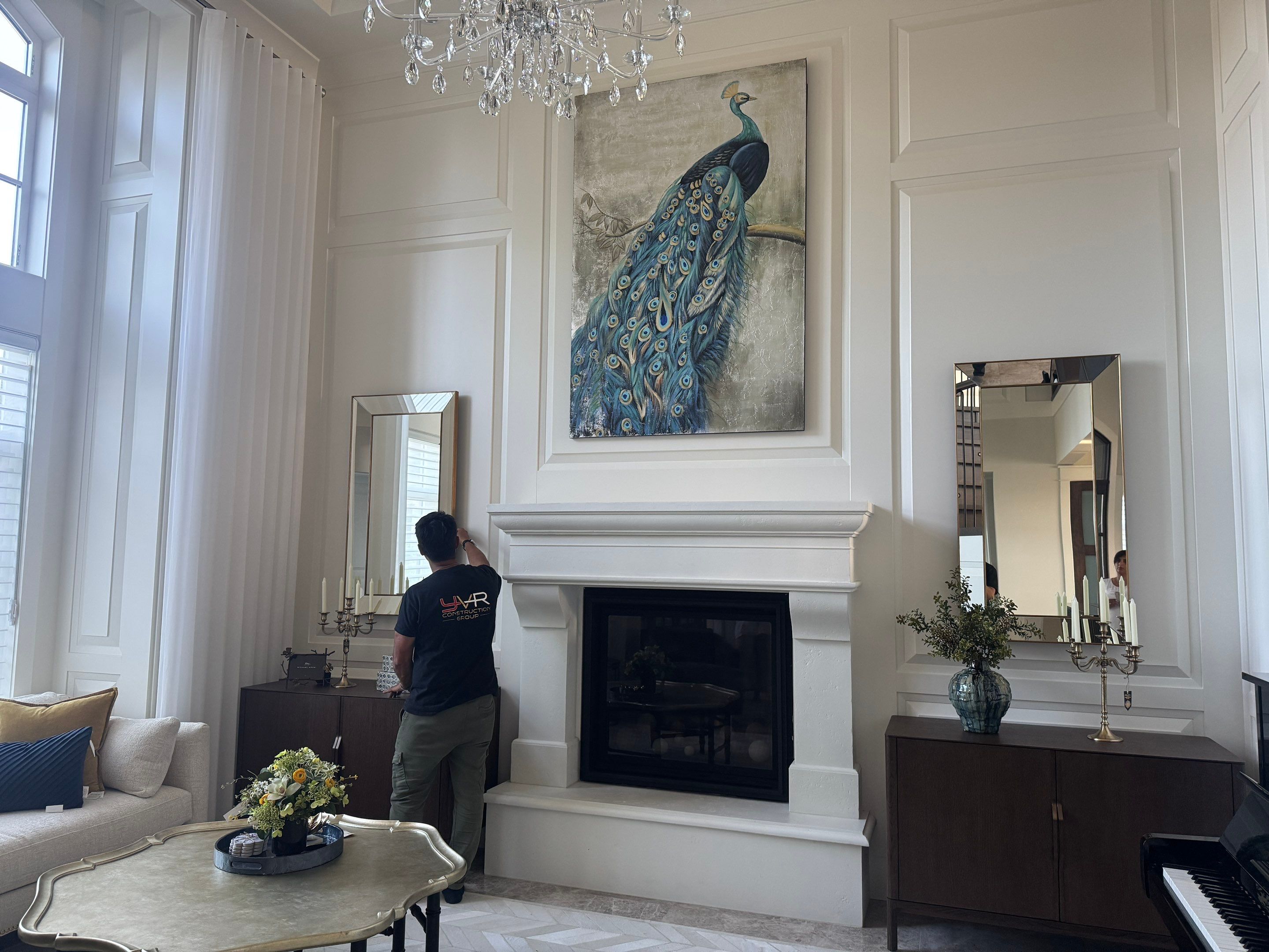 Professional Hanging of Mirrors & Art in a Designer Home by YVR Construction Group