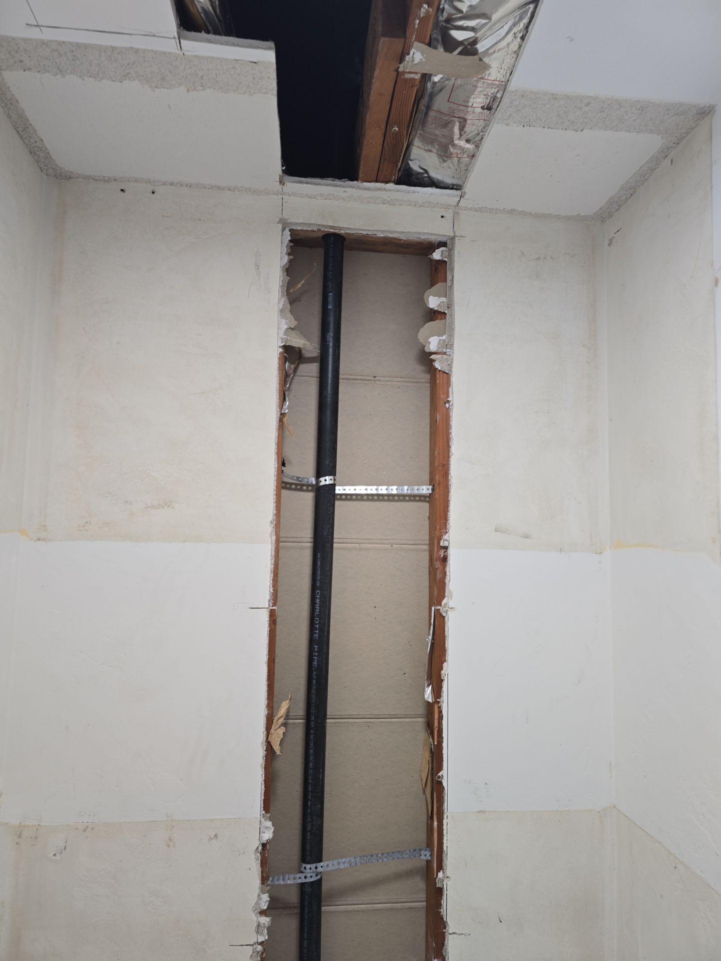 Installation of New Tall Black Piping (Wall to Ceiling) & Underground Piping by Us Plumbing