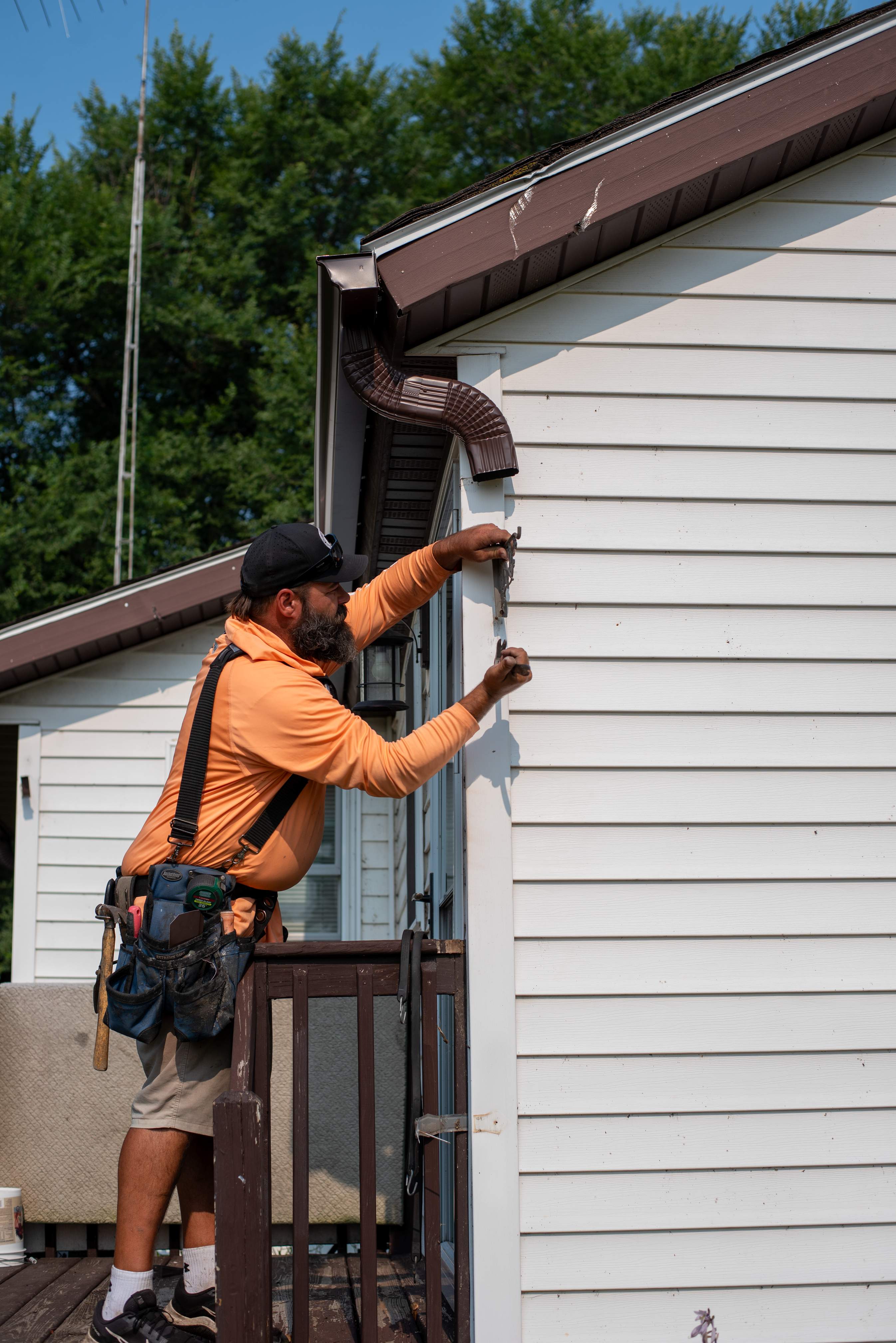 Royal Granite Siding Replacement & Brown Seamless Gutters by Next Level Seamless Gutters / Exteriors Inc.