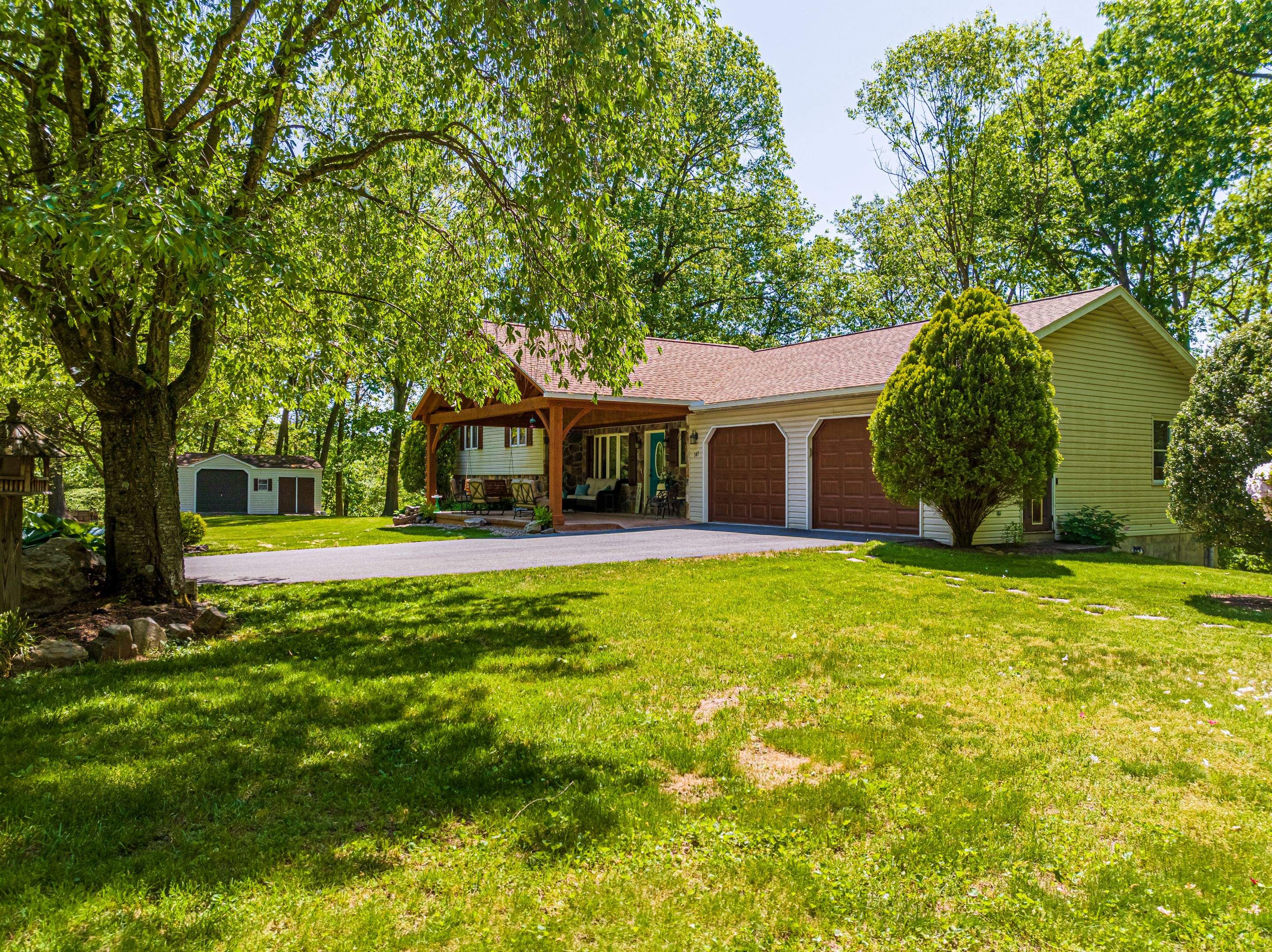 Reshingle-shakewood and timberframe patio roof by Esh Builders