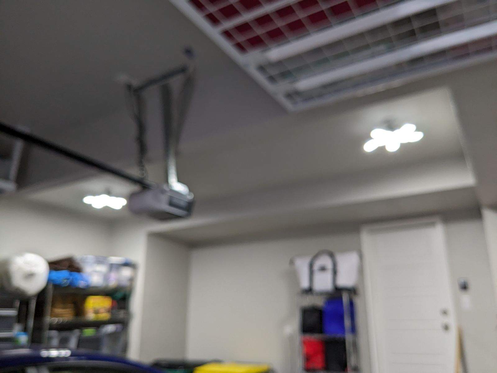 John H. maximized his storage with overhead racks and wall shelves by Banner Garage