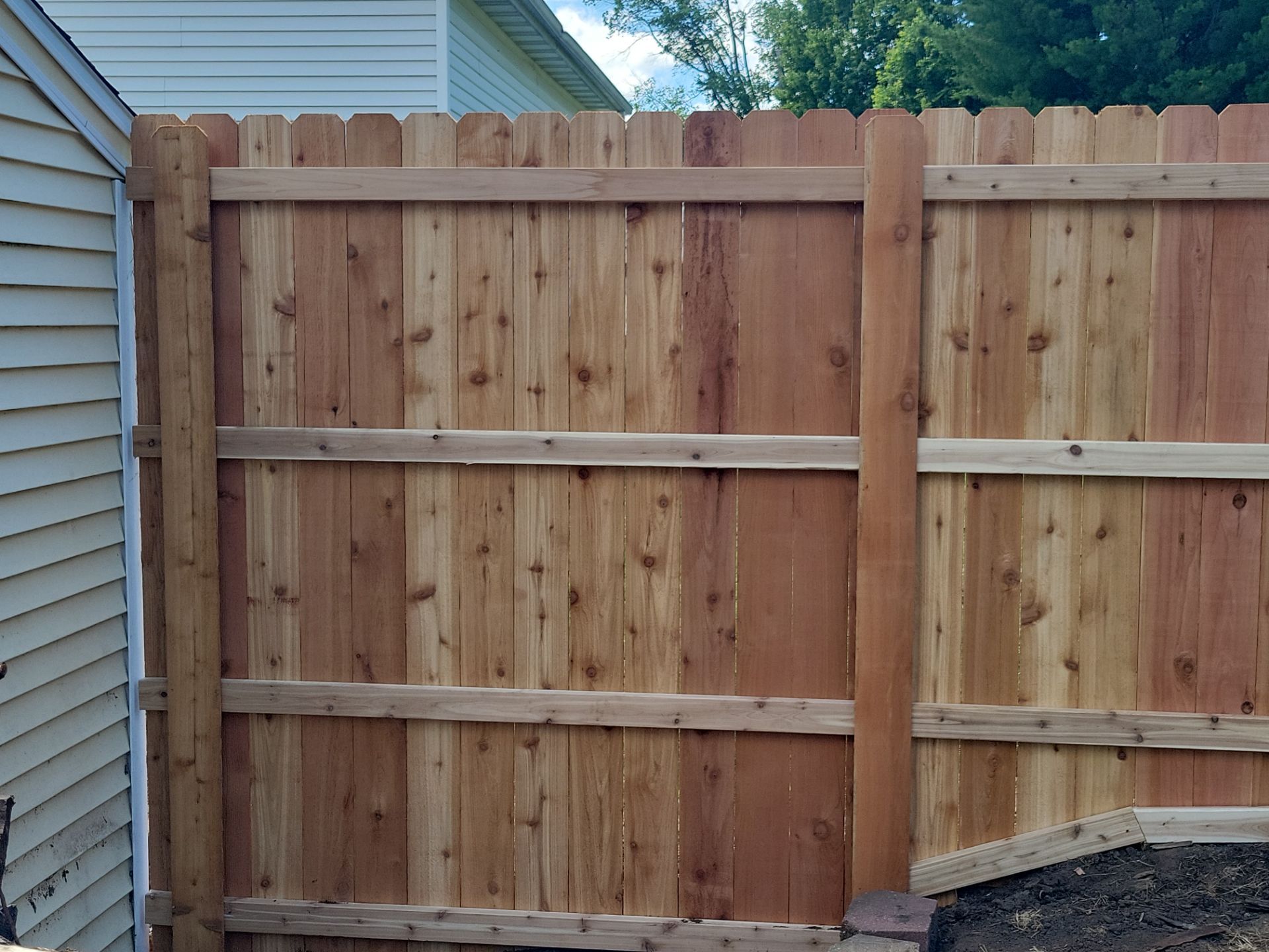 Custom Cedar Unstained Wood Privacy Fence Installation in Cedar Falls by Perfect Picket Fence and Stain