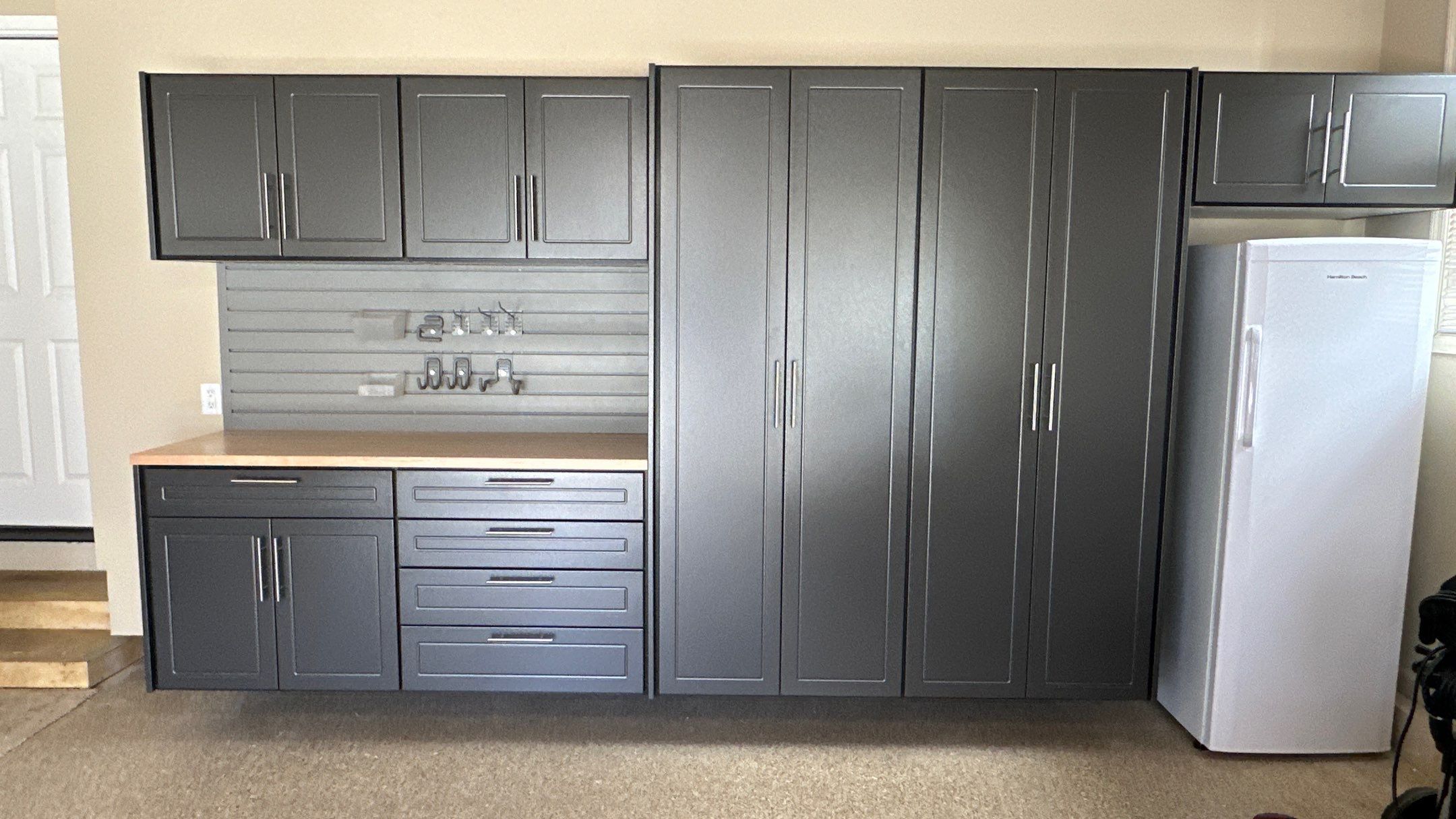Trevor F. got a workbench with his garage cabinets. by Banner Garage