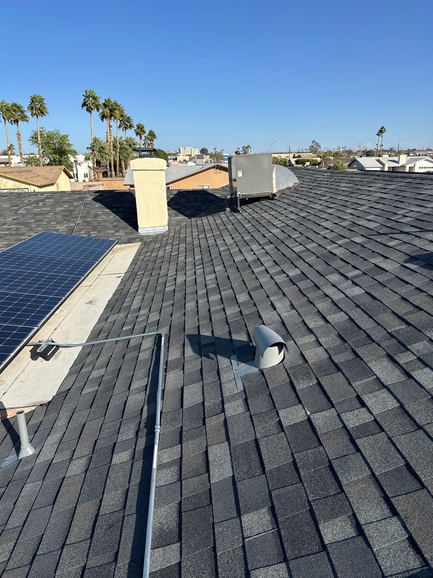 Charcoal Shingles by Reimagine Roofing