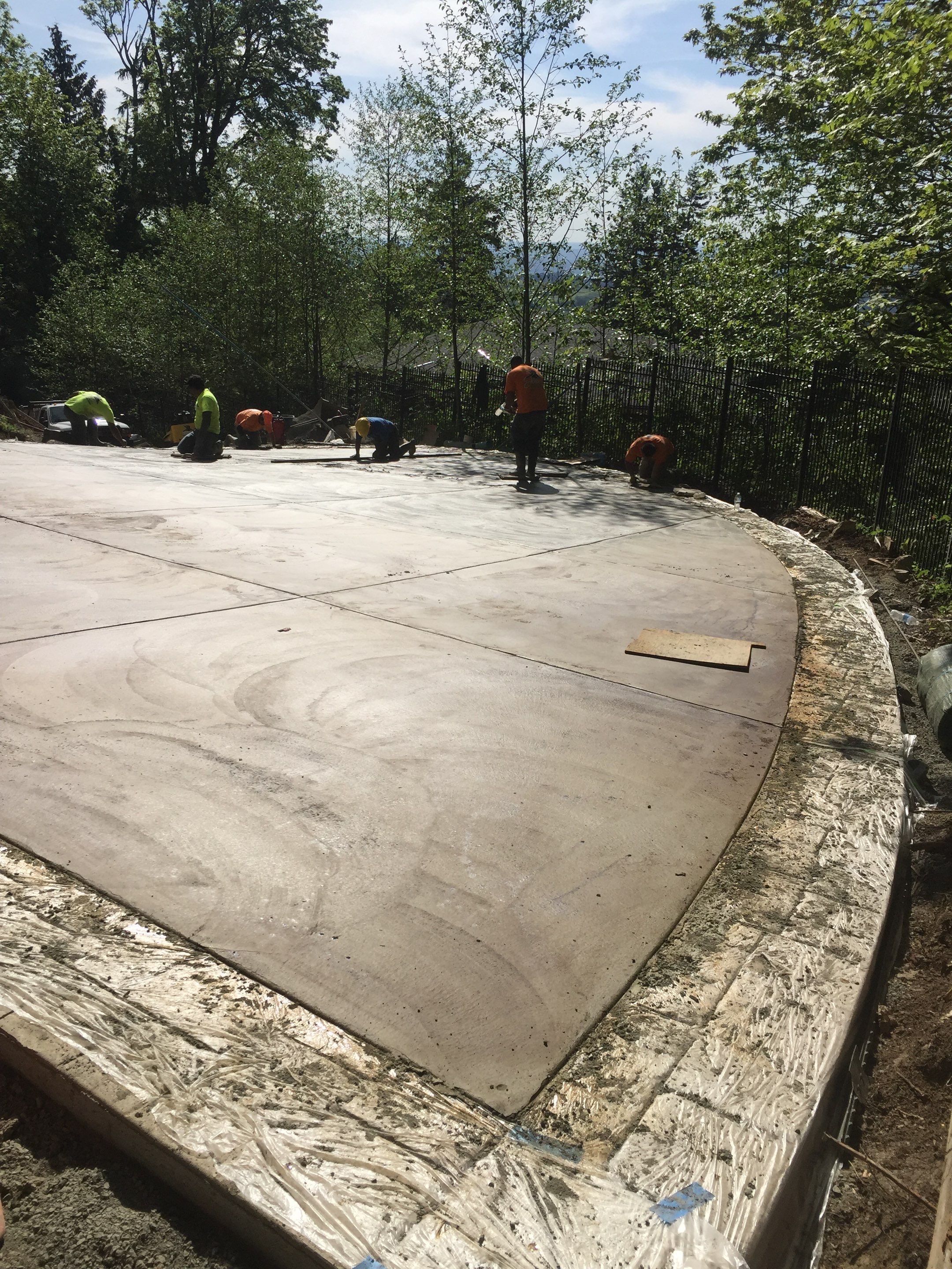 Asphalt Driveway and Stamped Concrete Patio Finish  by Jireh Asphalt & Concrete Inc 