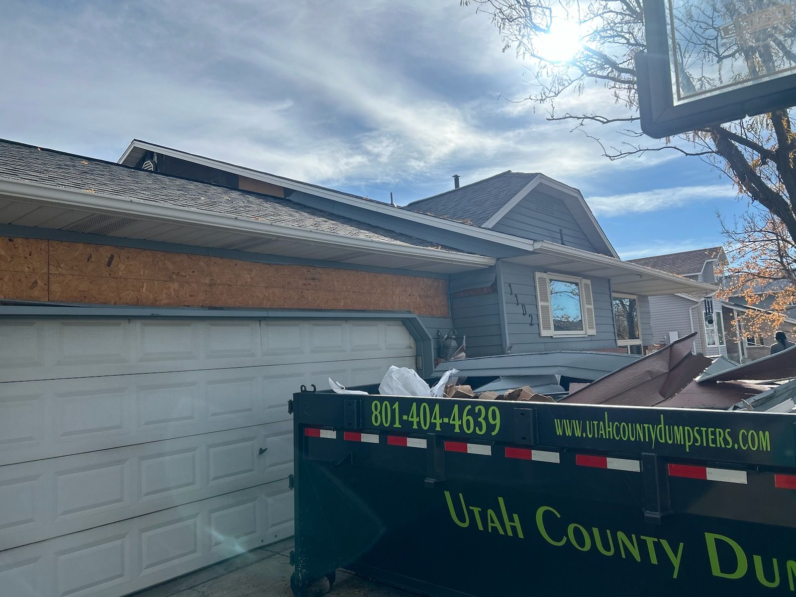 Aluminum Siding Replacement with Blue Dutch Lap Vinyl Siding and White Trim by ASAP Roofing & Exteriors
