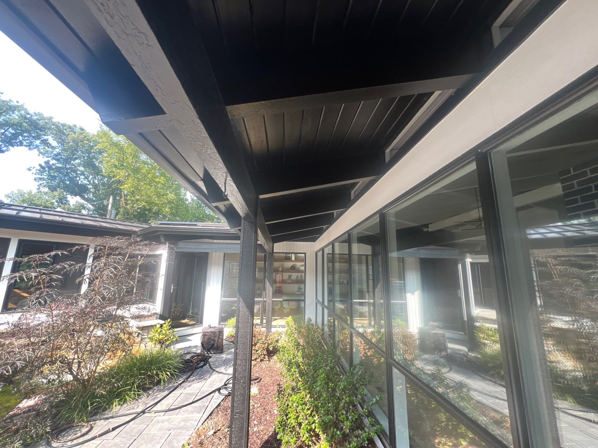 Complete Exterior House, Bluestone & Garage Floor Cleaning by Northern Power Washing LLC.