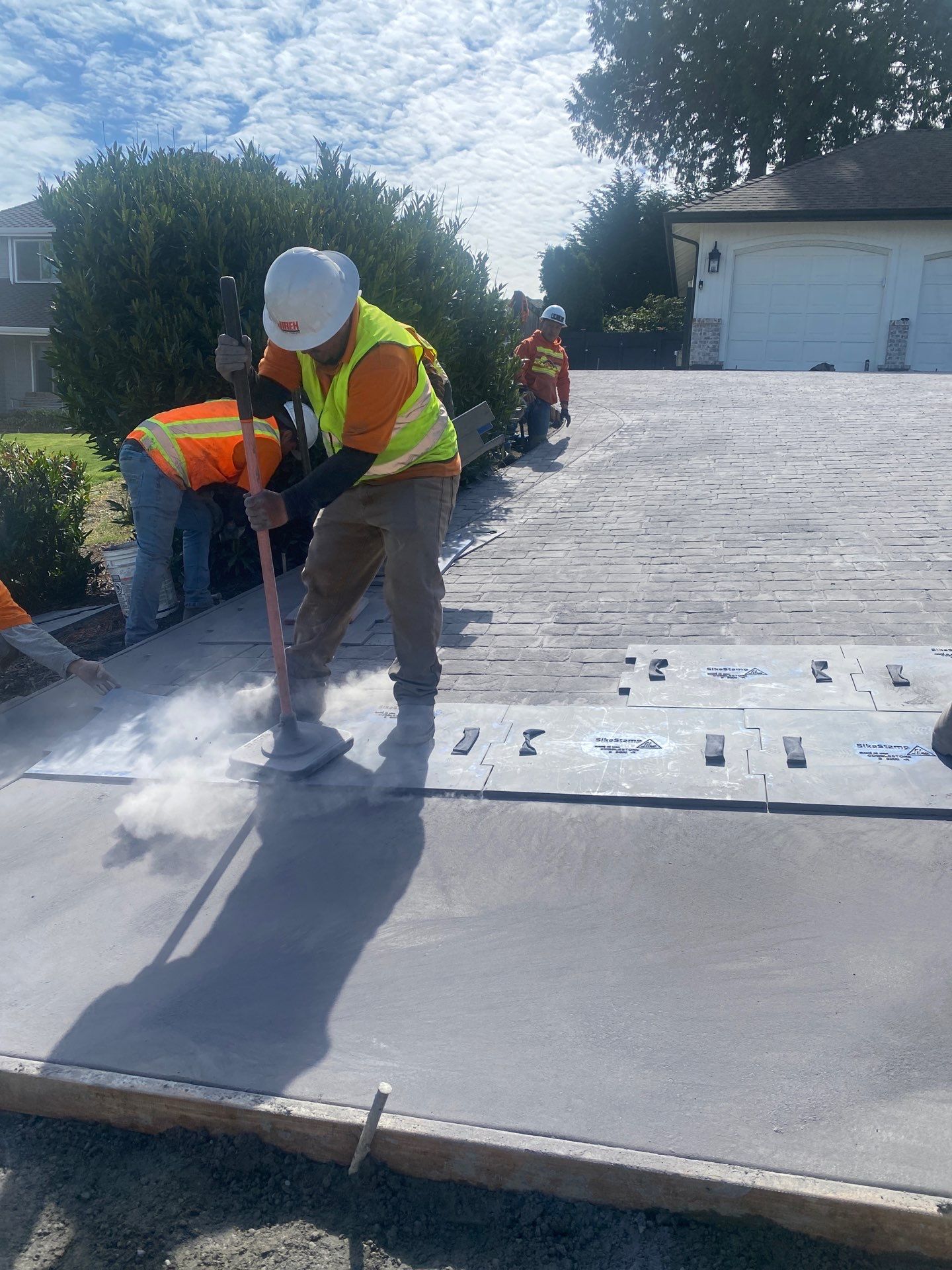 John | Stamped Concrete Driveway Makeover by Jireh Asphalt & Concrete Inc 