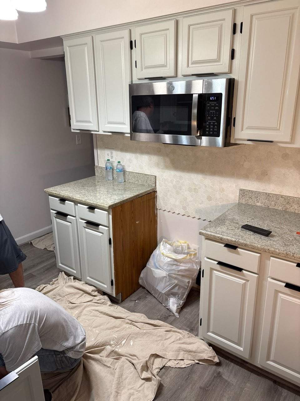 Two-Tone Kitchen Cabinet Refinishing and Granite Countertop Installation by Top Shelf Painter